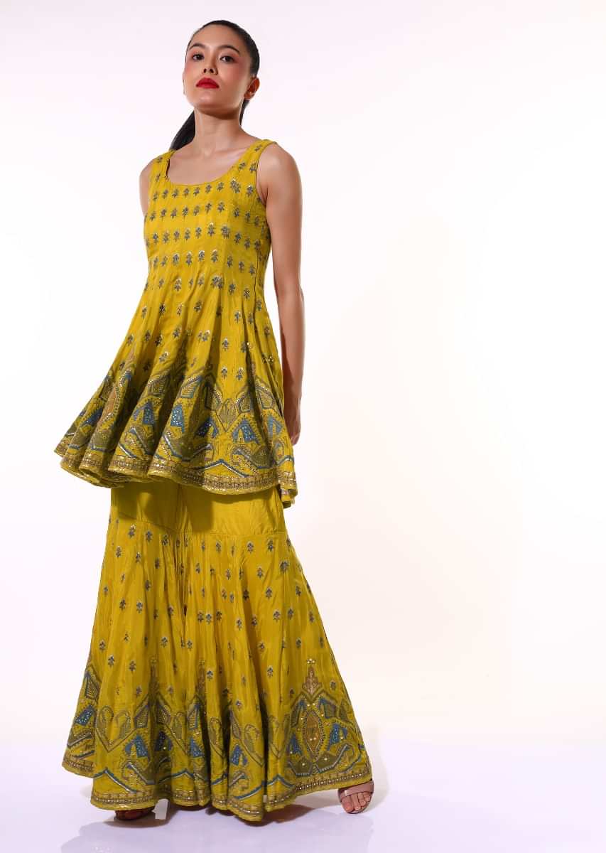 Mustard Sharara Suit With Peplum Kurti Adorned With Colorful Resham Embroidered Geometric Motifs And Butti Design  