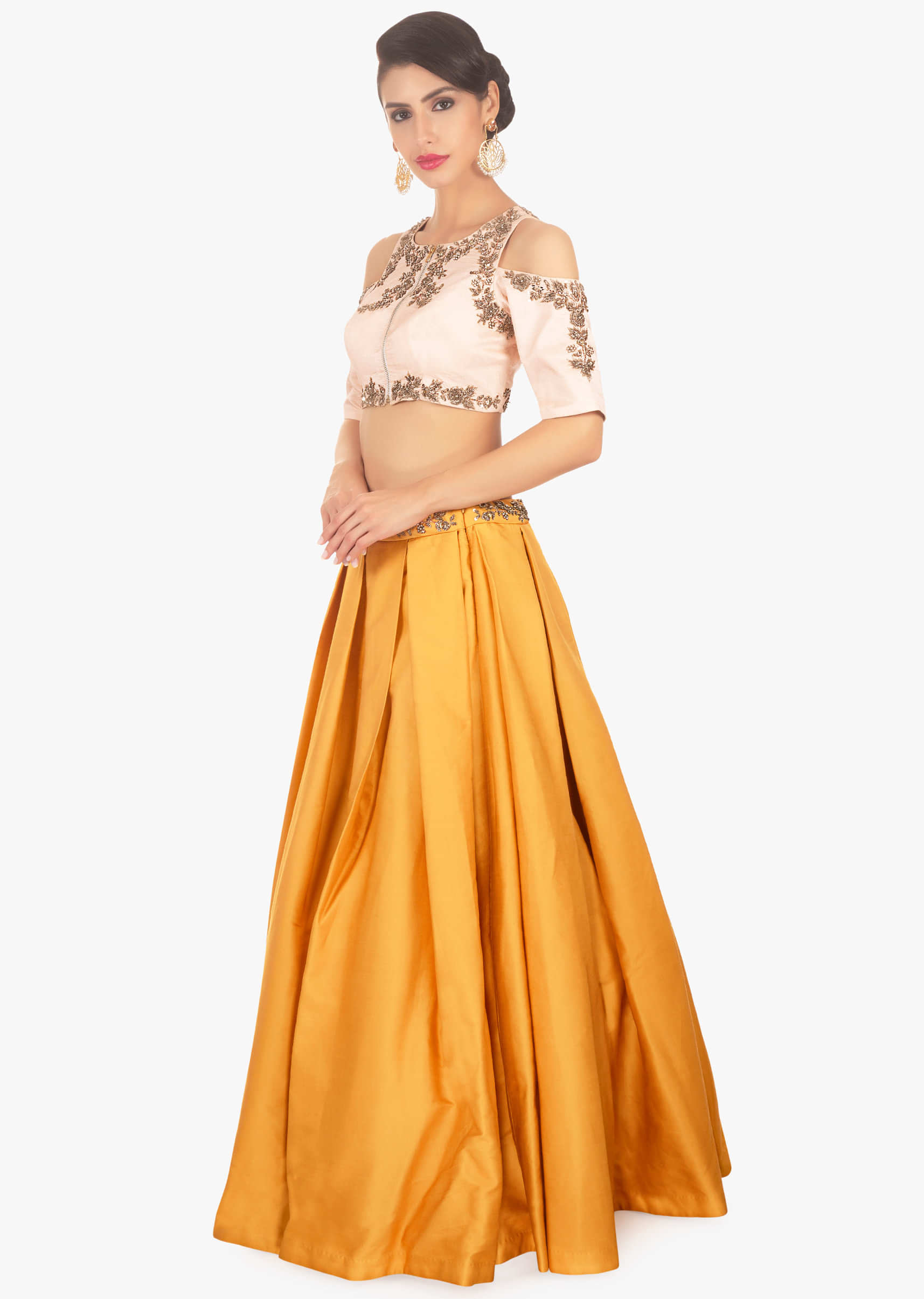 Mustard skirt paired with light peach cold shoulder crop top 