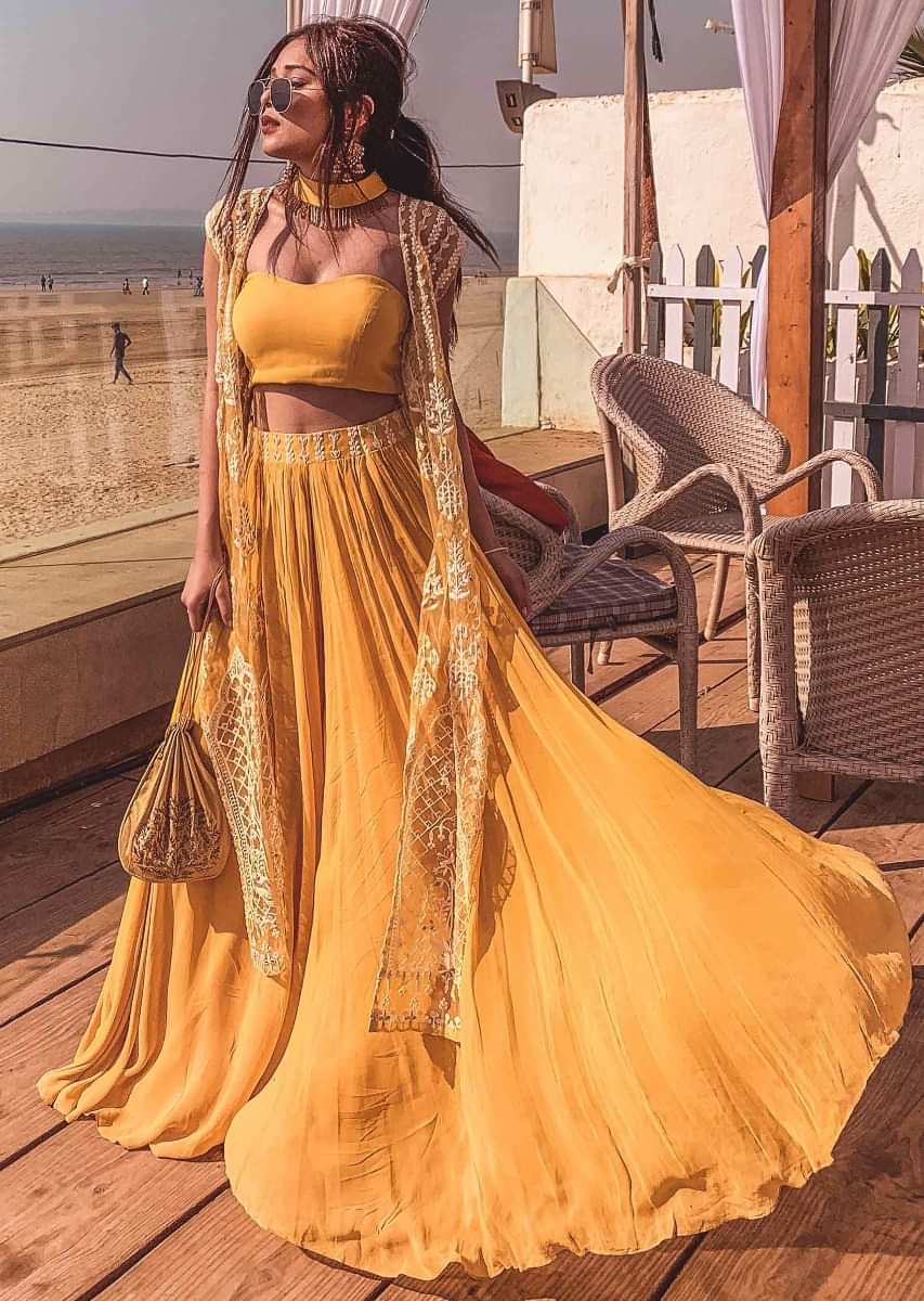 Mustard strapless corset blouse and palazzo with thread embroidered net jacket only on Kalki