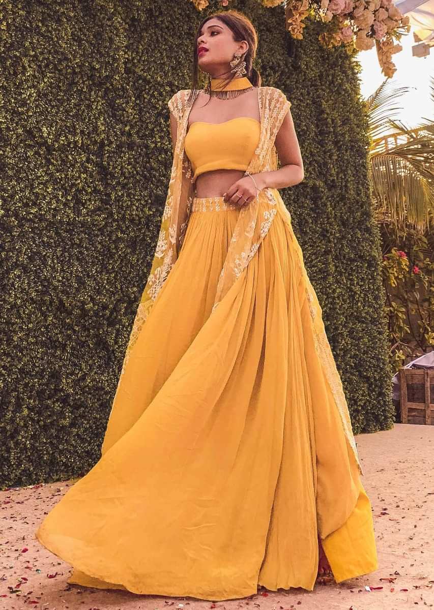 Mustard strapless corset blouse and palazzo with thread embroidered net jacket only on Kalki
