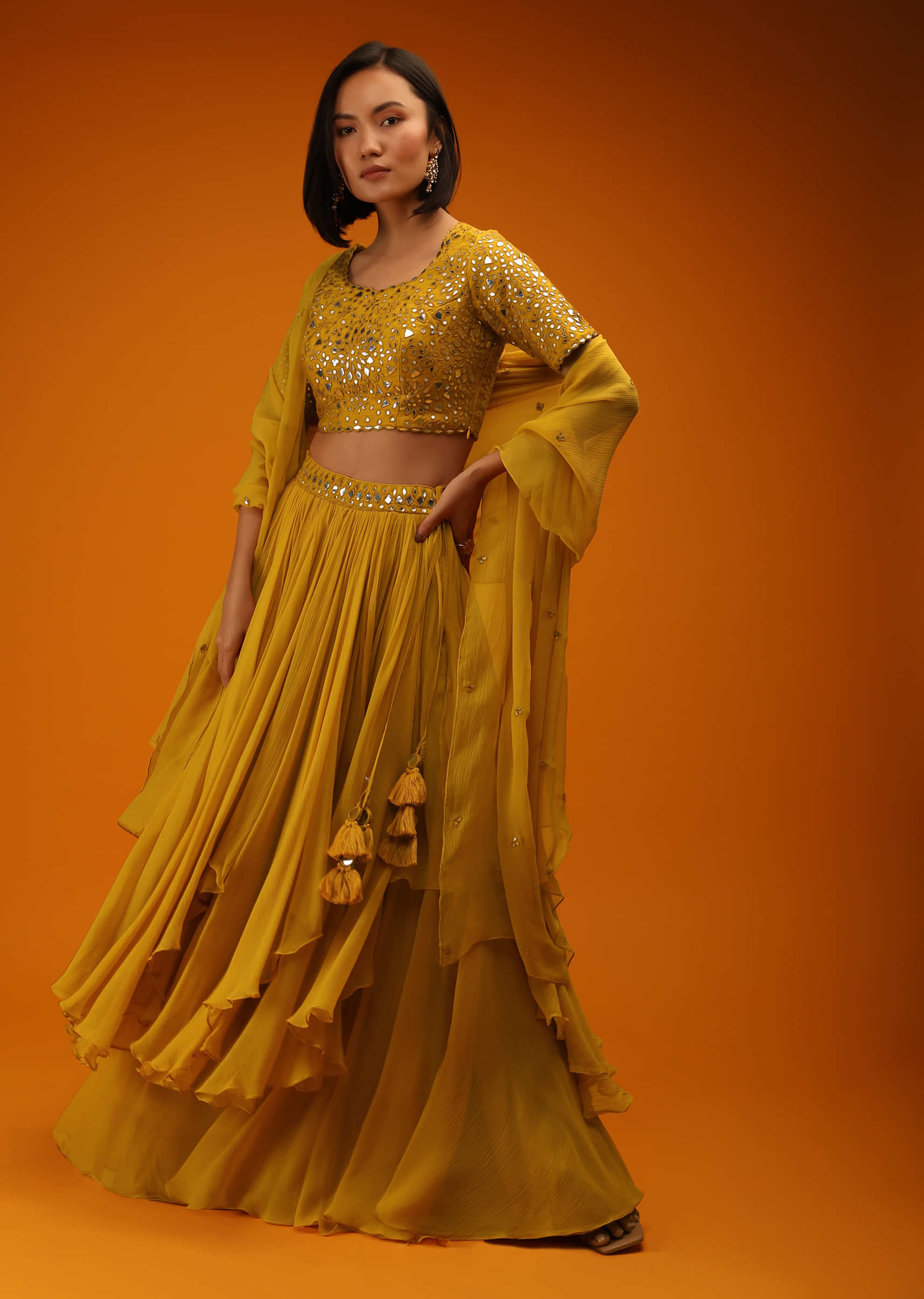 Mustard Lehenga Choli In Chiffon With High Low Layers And Mirror Embroidery