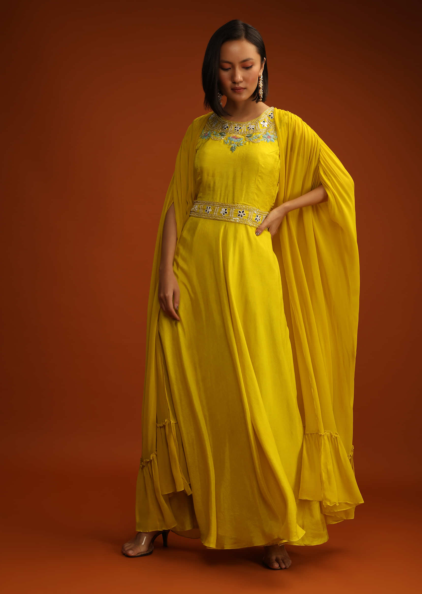 Mustard Yellow Indowestern Dress With Long Extended Cape Sleeves And Multi Colored Hand Embroidery