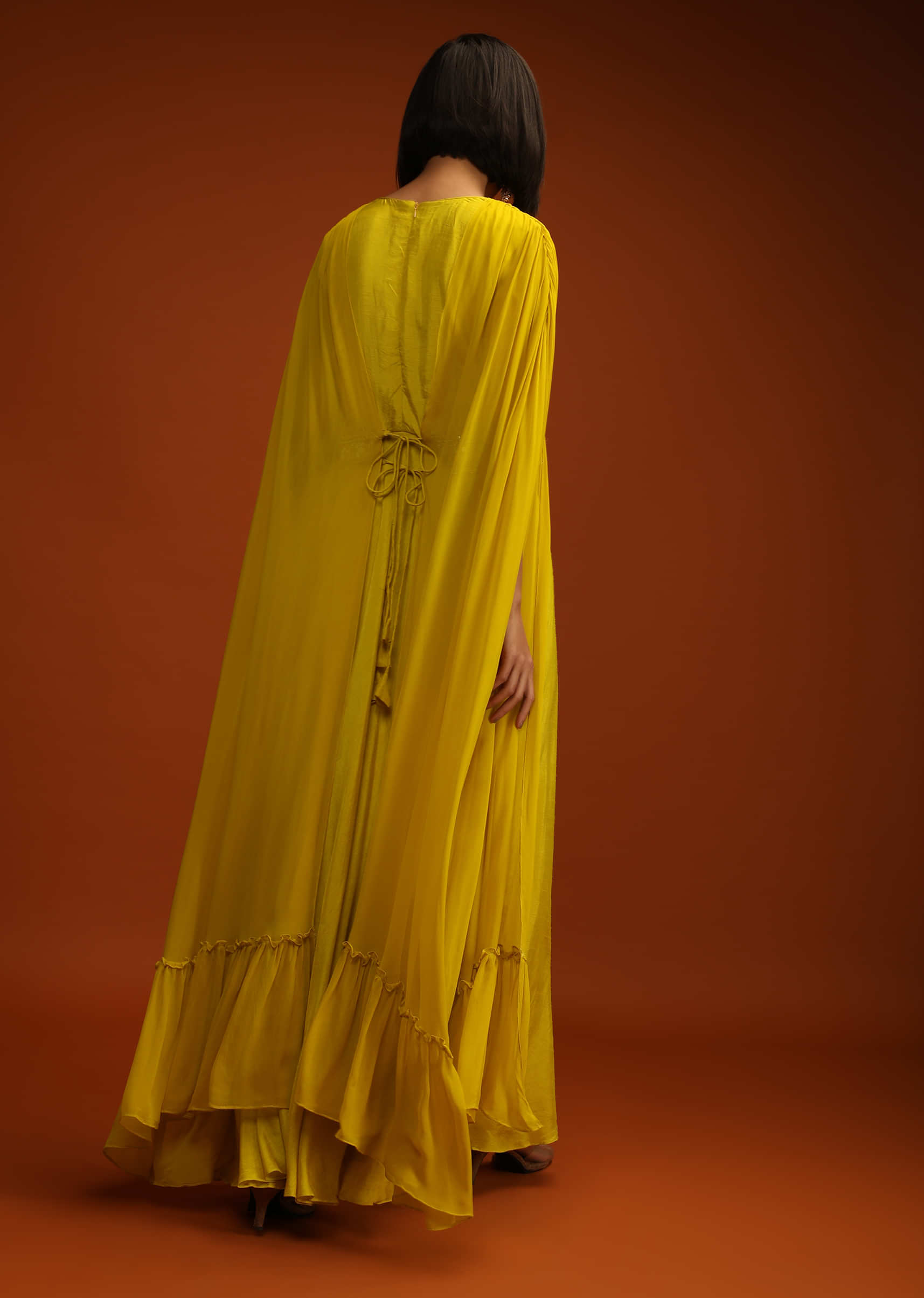 Mustard Yellow Indowestern Dress With Long Extended Cape Sleeves And Multi Colored Hand Embroidery