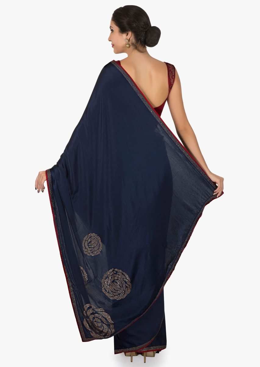 Navy blue and red saree in satin with unstitched blouse crafted in kundan embroidery work