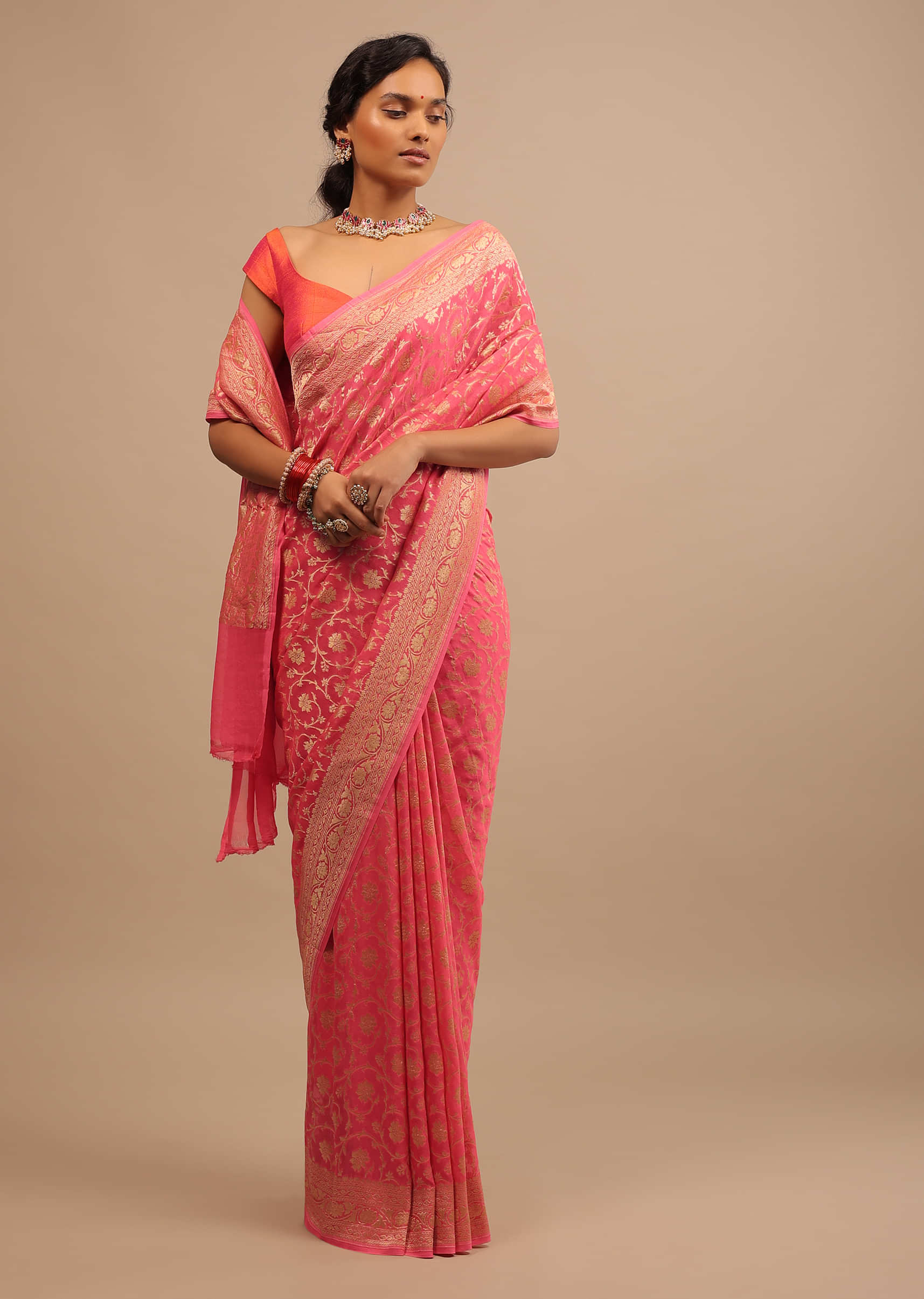 Peach Pink Traditional Georgette Saree With Golden Jaal Work In Floral Motif