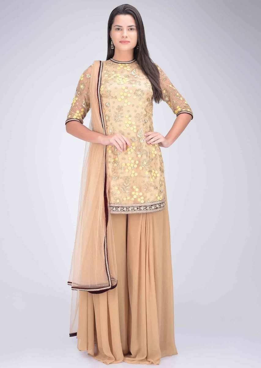 Ochre yellow embroidered short kurti and palazzo suit set only on Kalki