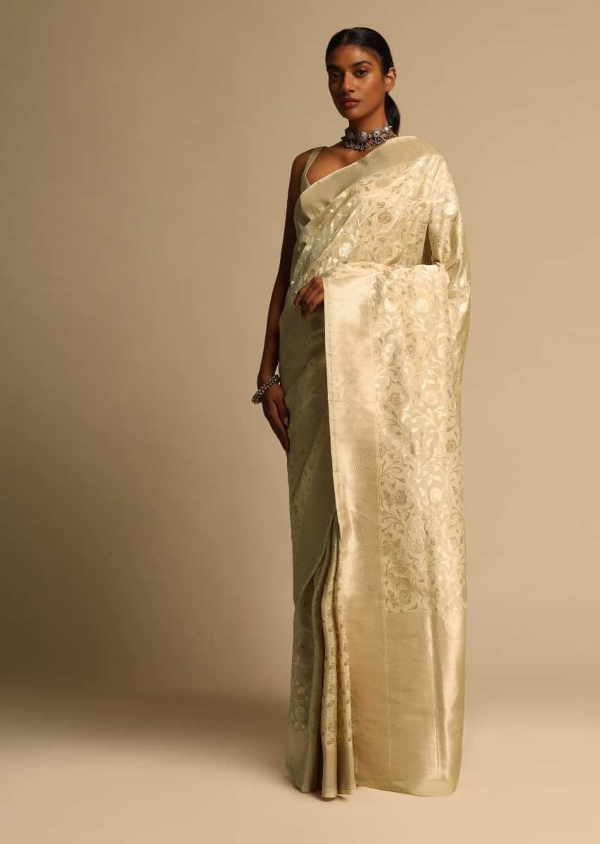 Beige Banarasi Saree In Pure Handloom Silk With Woven Floral Jaal And Floral And Checks Border Along With Unstitched Blouse Piece  