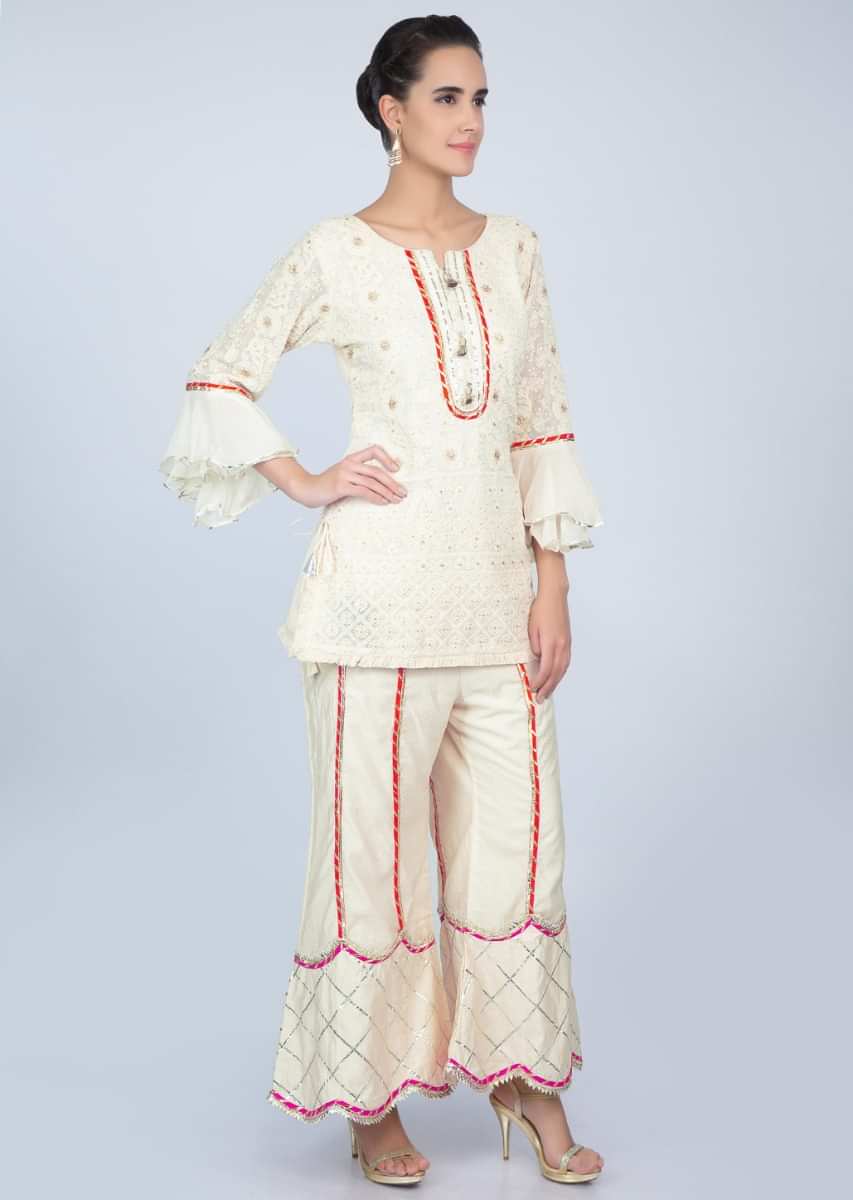 Off white chicken embroidered suit with  matching palazzo pant only on kalki