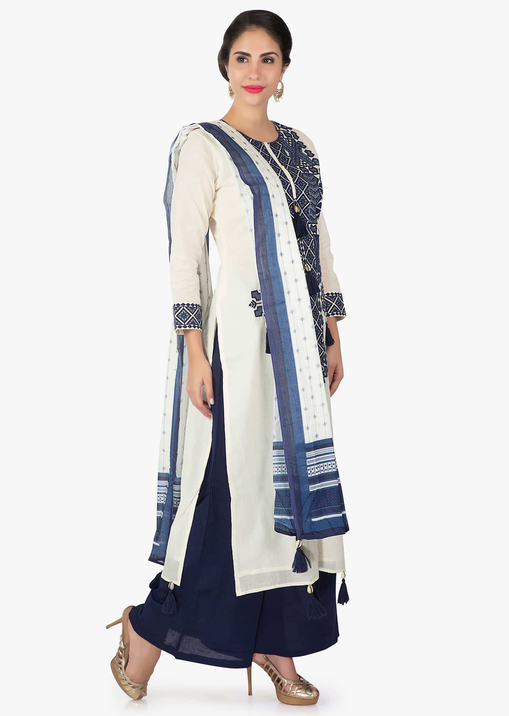Off white cotton kurti with neckline in navy blue resham work and tassel