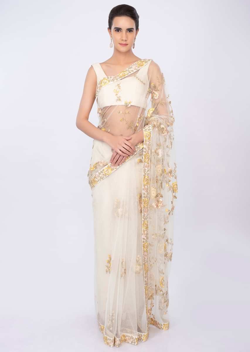 Off white net saree with floral embroidery and butti only on kalki