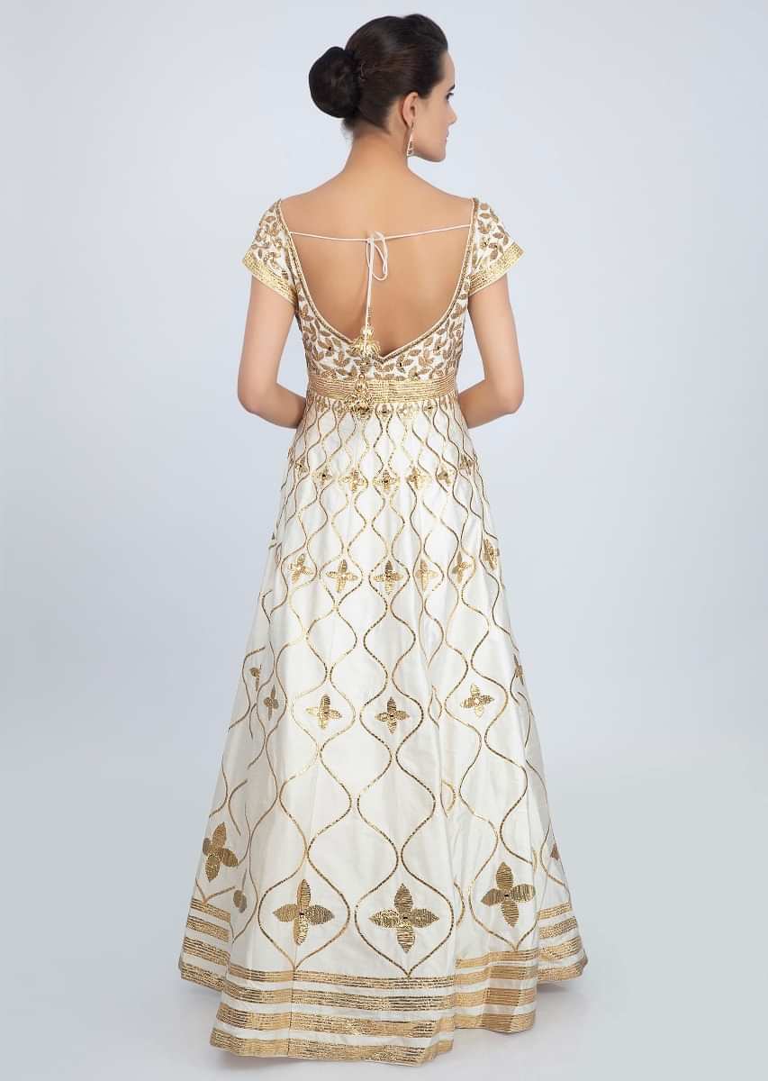 Off White Anarkali Suit In Raw Silk With Golden Embroidery Online - Kalki Fashion