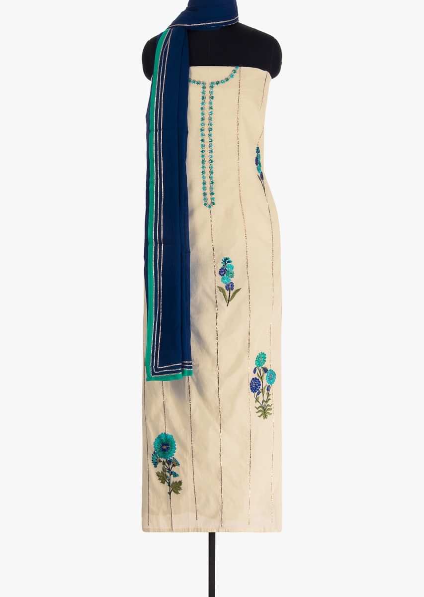 Off white unstitched silk suit in lace stripes and resham embroidered butti 