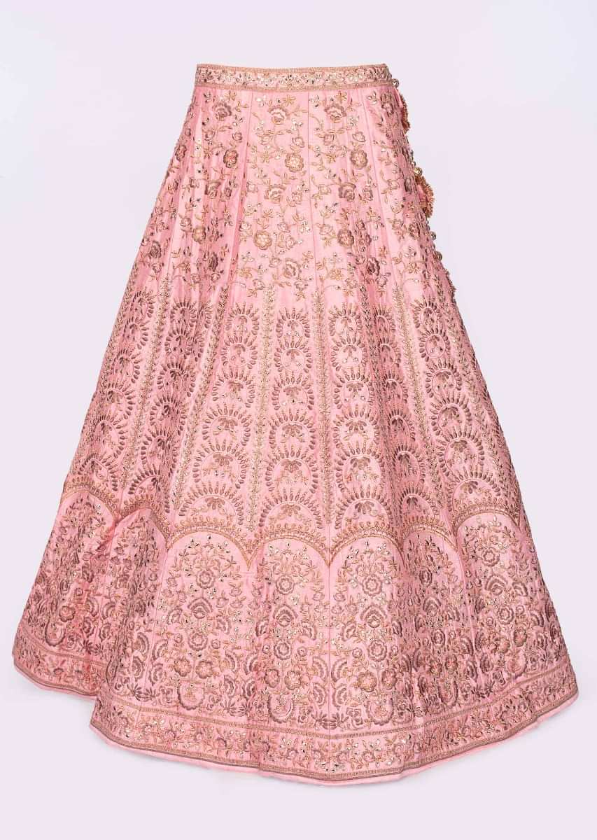 Olive green blouse paired with pink heavy embroidered lehenga and net dupatta