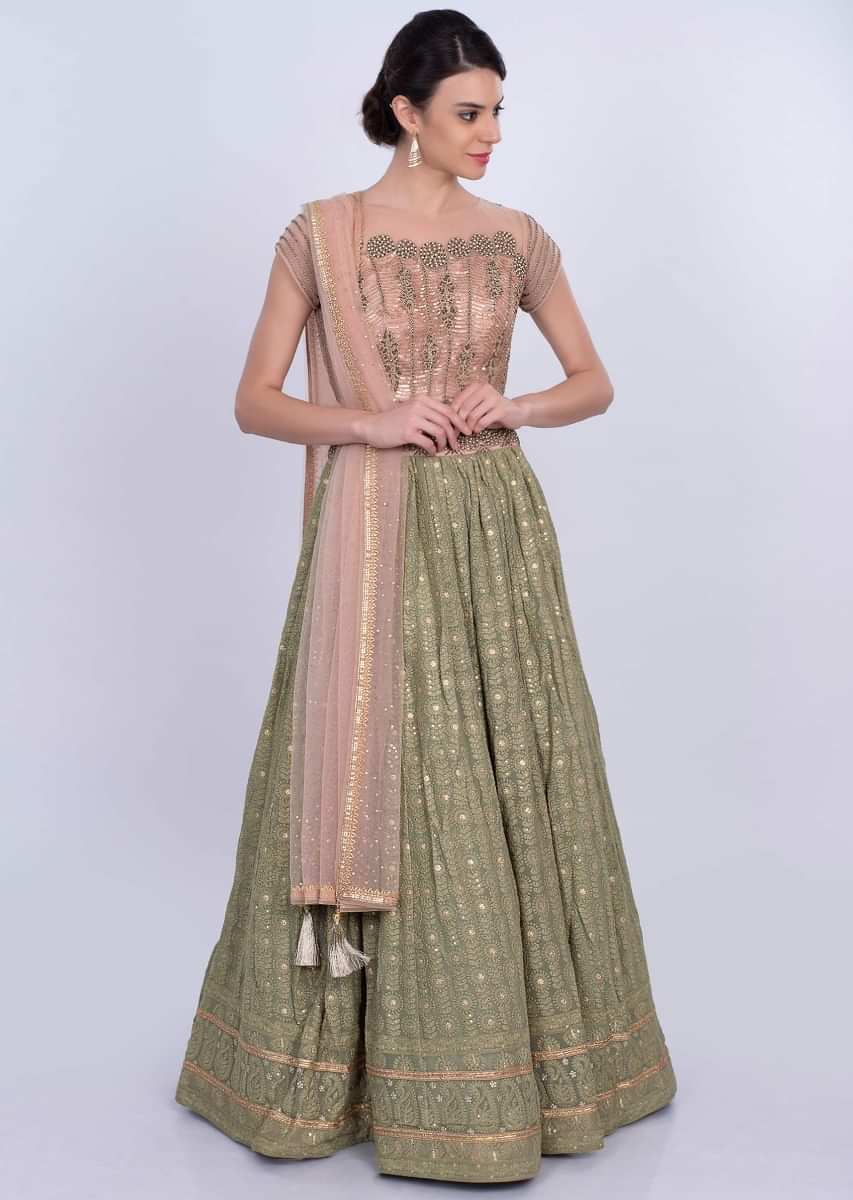 Olive green self thread lehenga with dusty rose pink embroidered blouse and net dupatta only on Kalki