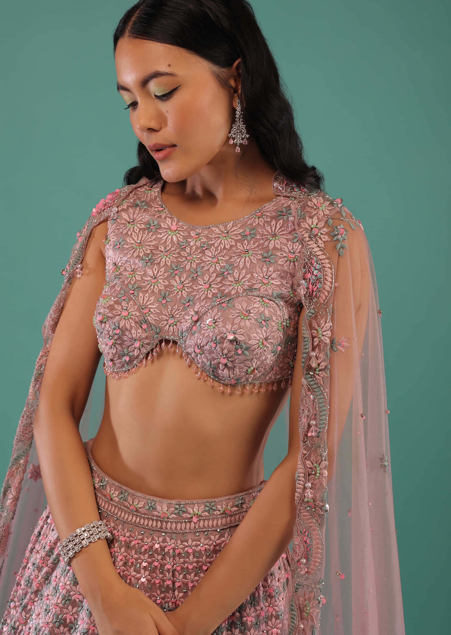 Onion Pink Organza Lehenga And Crop Top With Multi Colored Resham Embroidered Flowers And A Designer In-Cut Hemline