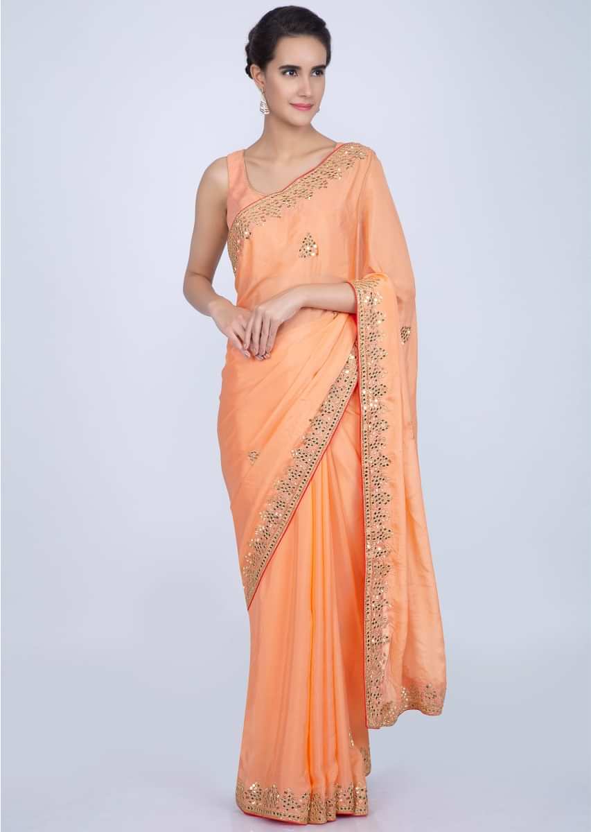 Orange chiffon silk saree with embroidered butti border only on Kalki