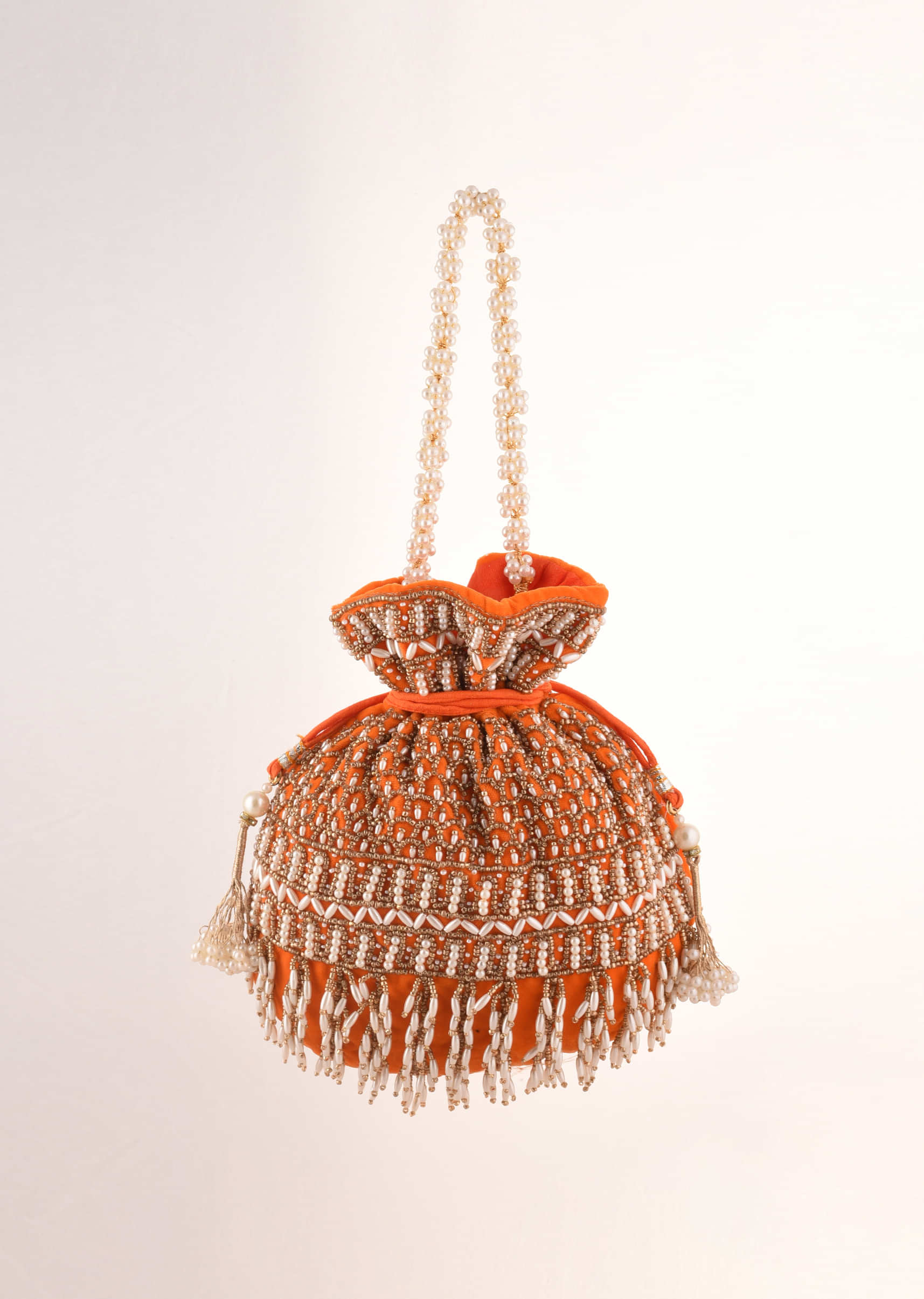 Orange Potli In Velvet Heavily Embroidered With Beads And Moti Work In Scalloped And Tassel