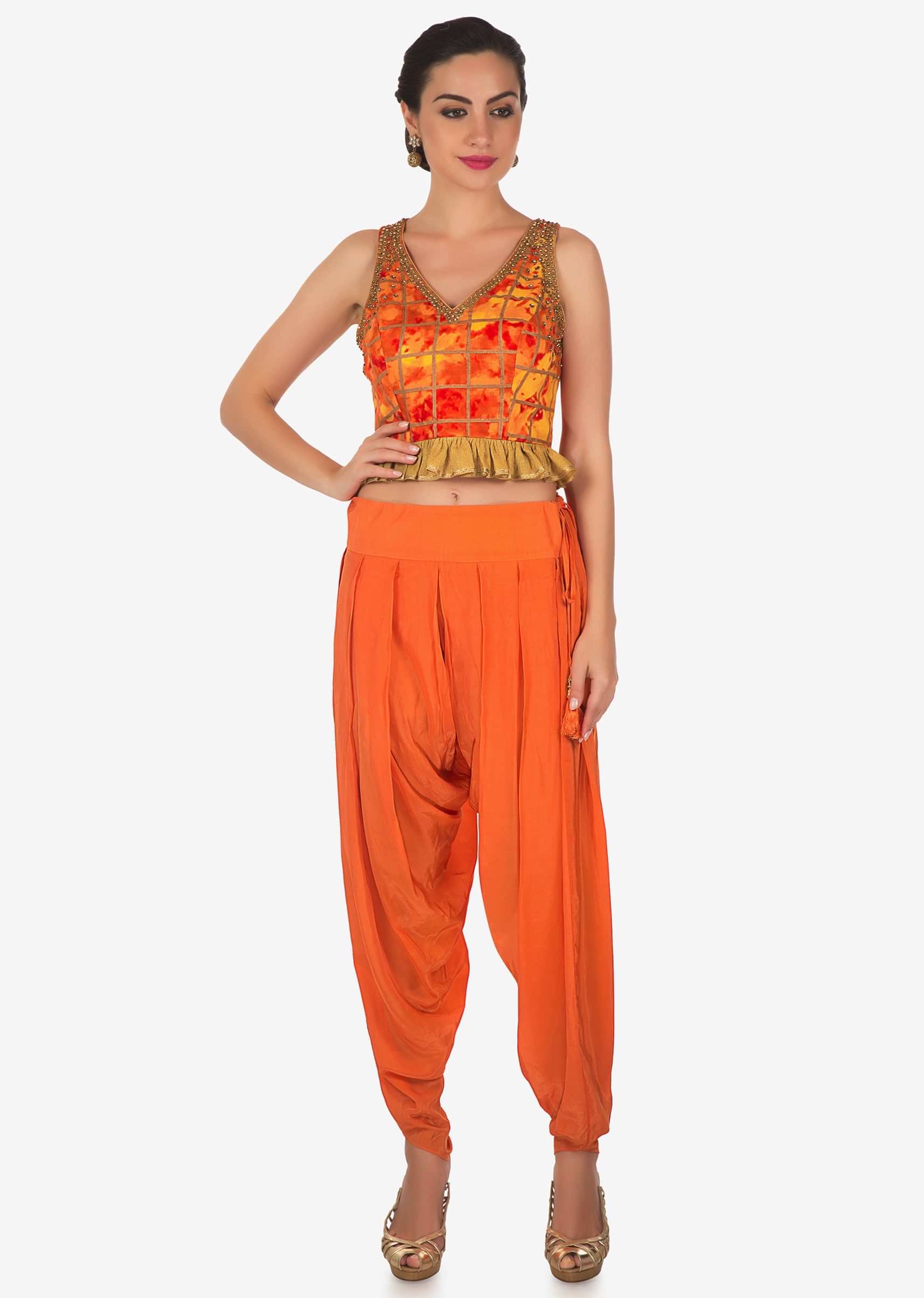 Orange dhoti pants with crop top blouse in kundan embroidery only on Kalki