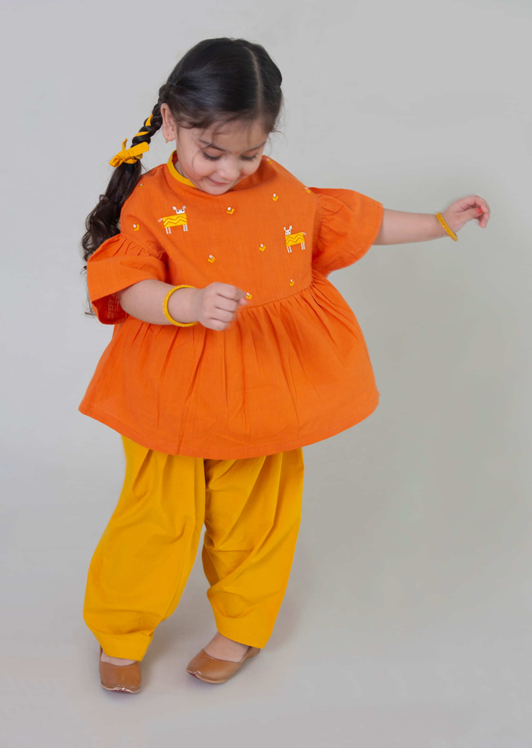 Kalki Girls Orange Dhoti Suit With Phulkari Inspired Deer Motifs By Tiber Taber
