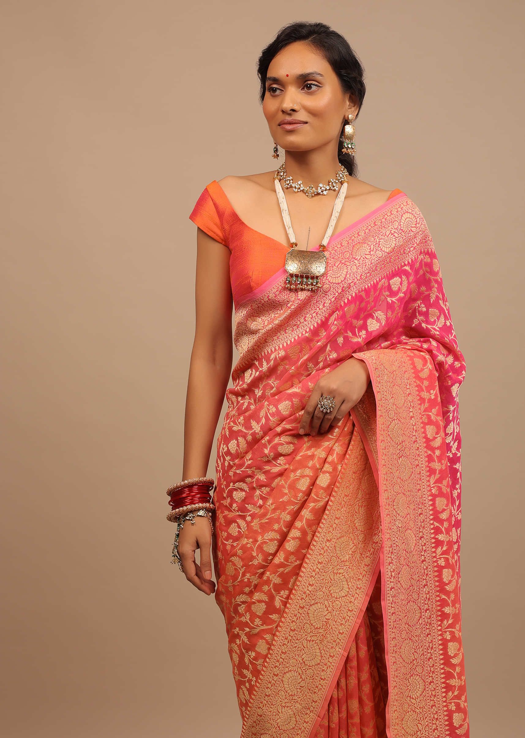 Orange Peach Traditional Saree Made With Georgette And Beautified With Golden Jaal 