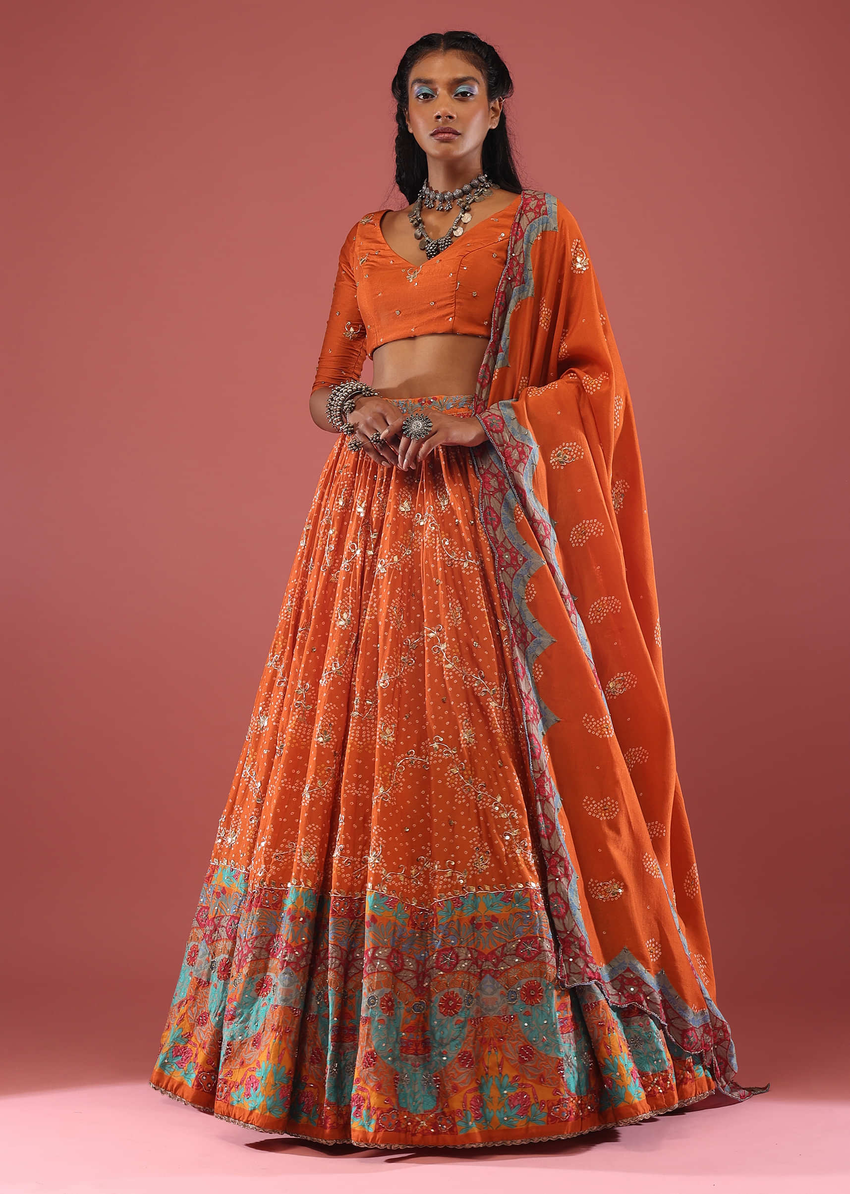 Orange Silk Bandhni Print Lehenga With Elaborate Hand Embroidery Including Gota Patti, Cutdana, And Sequins.