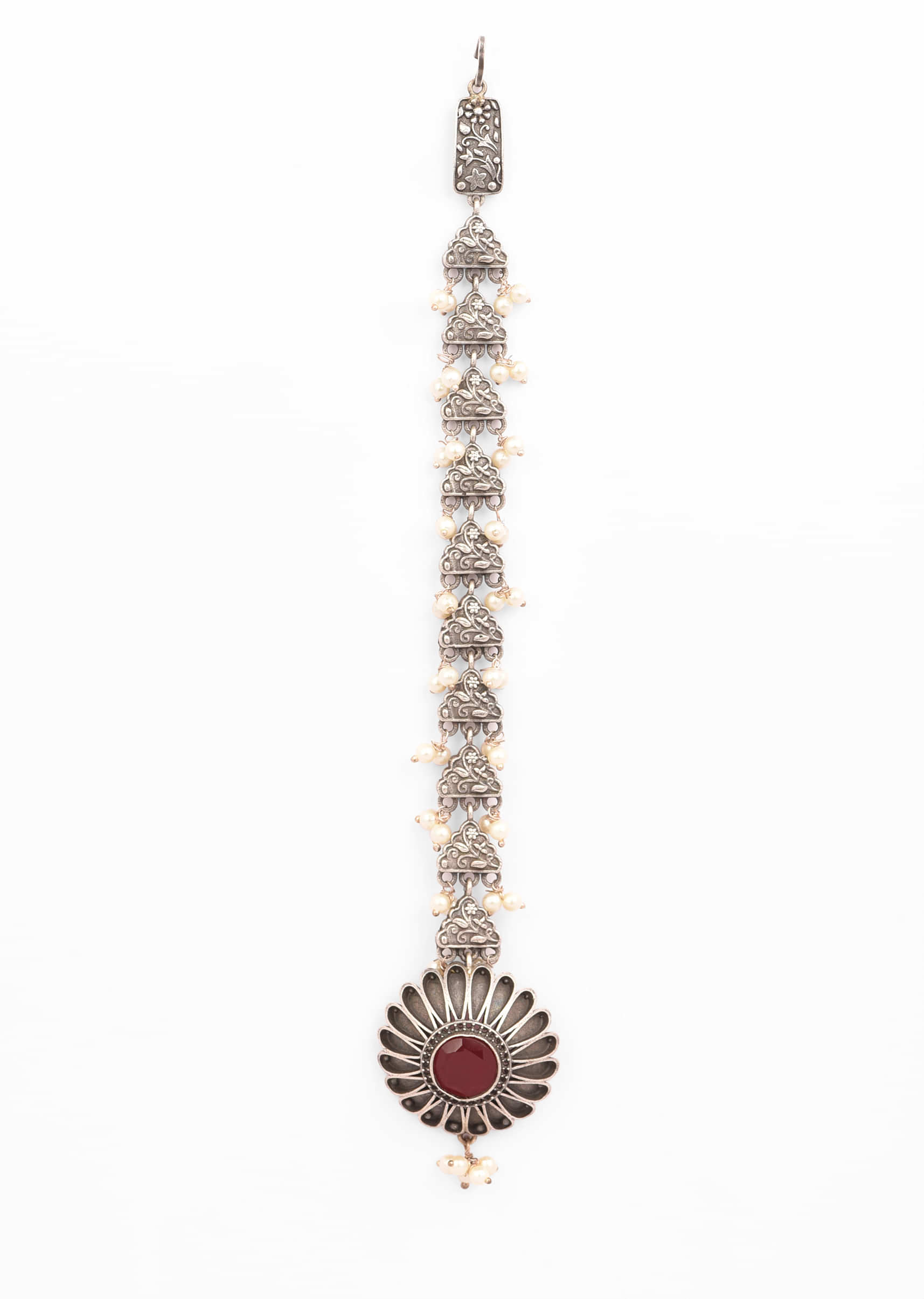 Oxidised Silver Mangtika With Carved Flower Studded In Red Stones And Pearl Tassels 