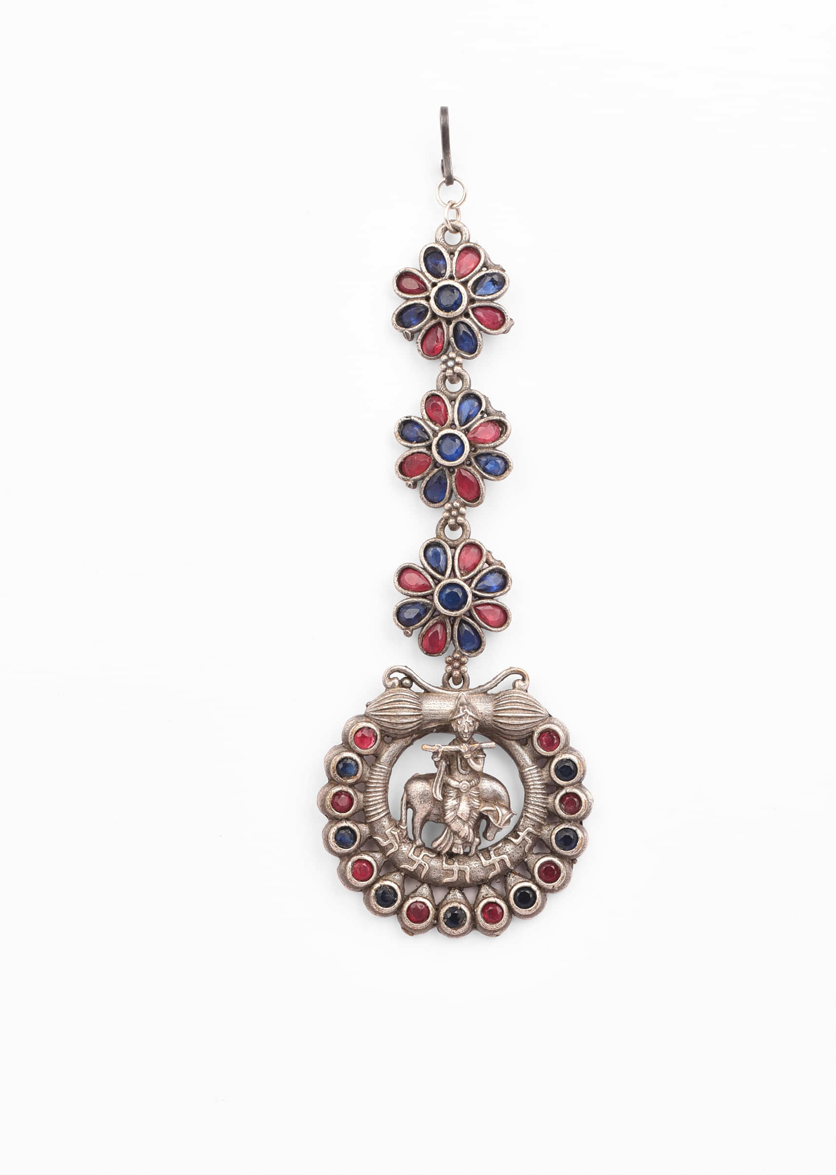 Oxidised Silver Mangtika With Carved Lord Krishna Motif Studded In Pink And Blue Stones 