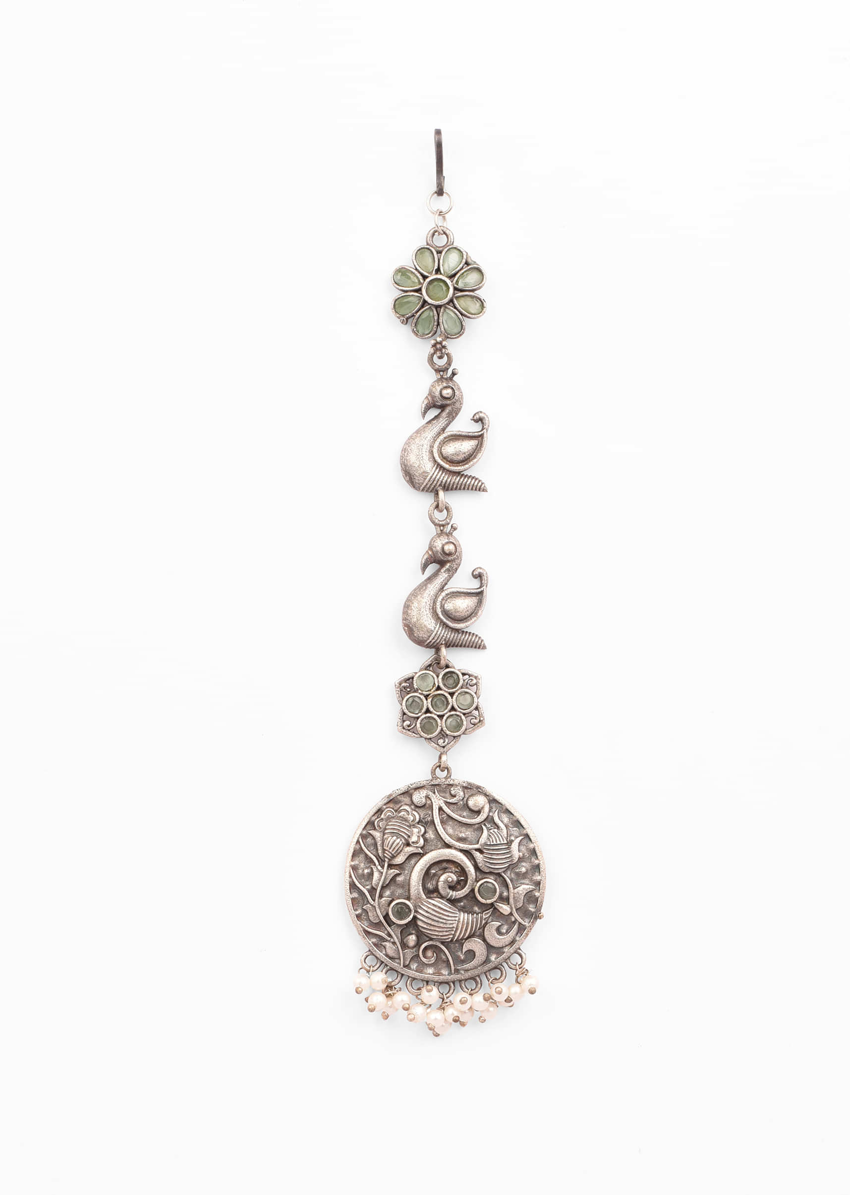 Oxidised Silver Mangtika With Carved Peacock Motif And Studded In Green Stones 