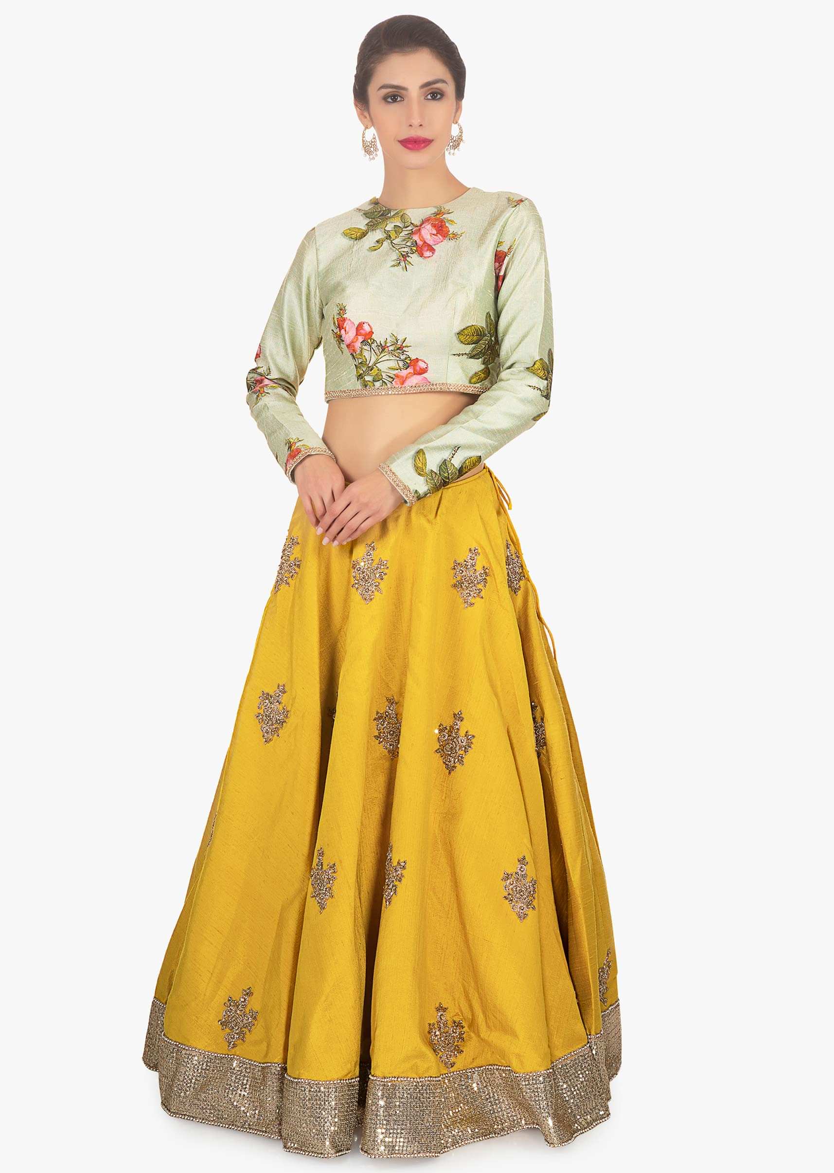 Oyster green raw silk blouse paired with mustard lehenga and floral printed dupatta 
