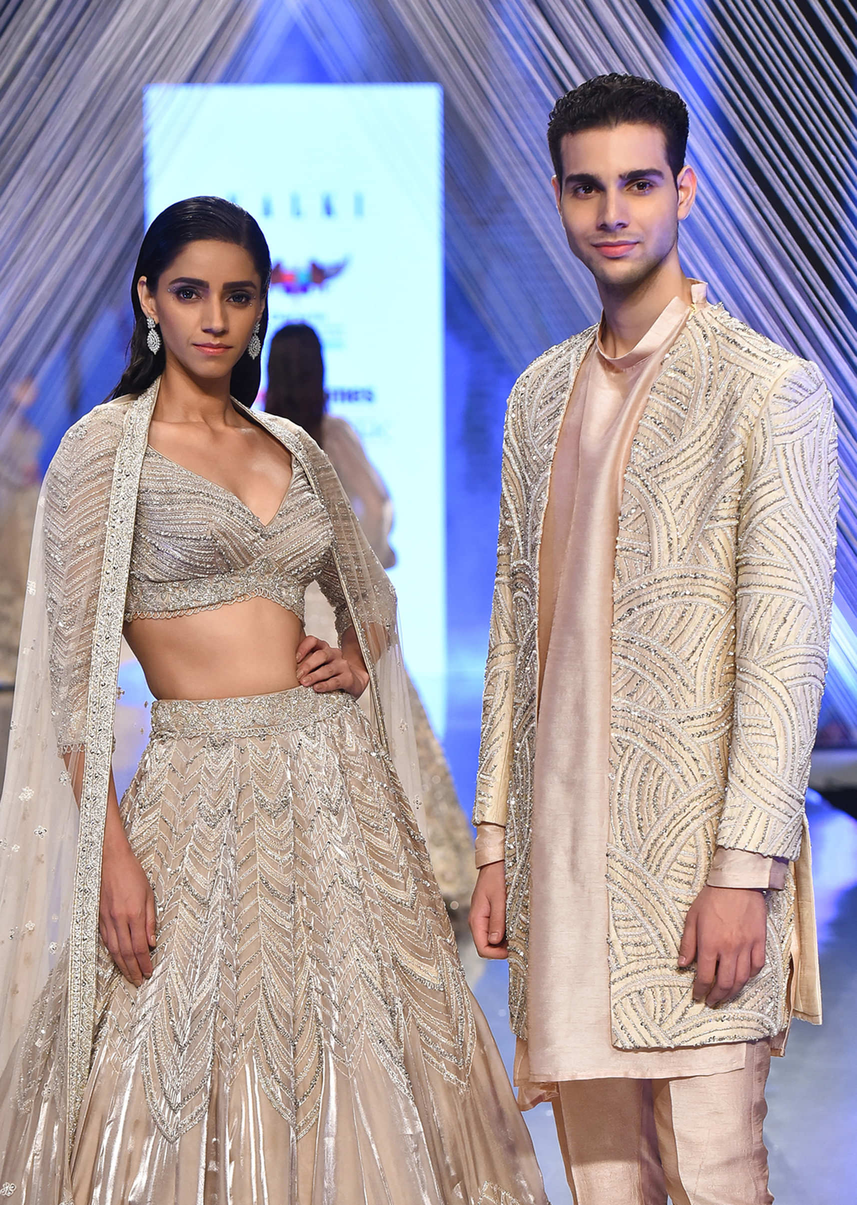 Oyster Organza Lehenga Adorned With Cut Dana Embroidery And A 3/4Th Sleeves Crop Top With A Deep V Neckline
