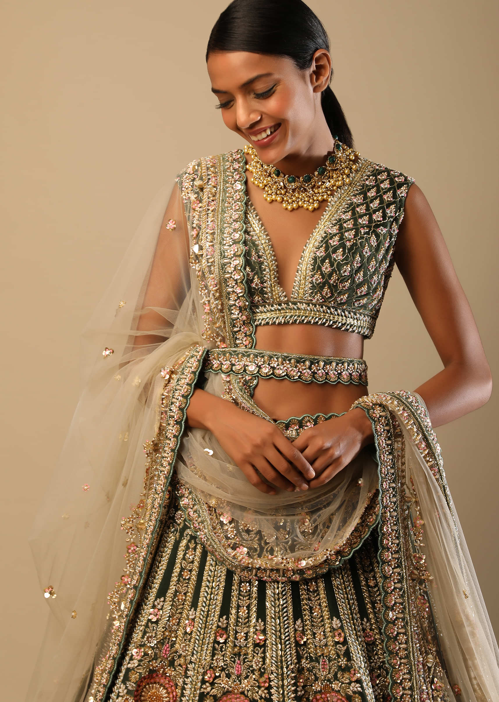 Palace Green Lehenga Choli In Velvet With Multi Colored Hand Embroidered Heritage Kalis With Hints Of Flowers 