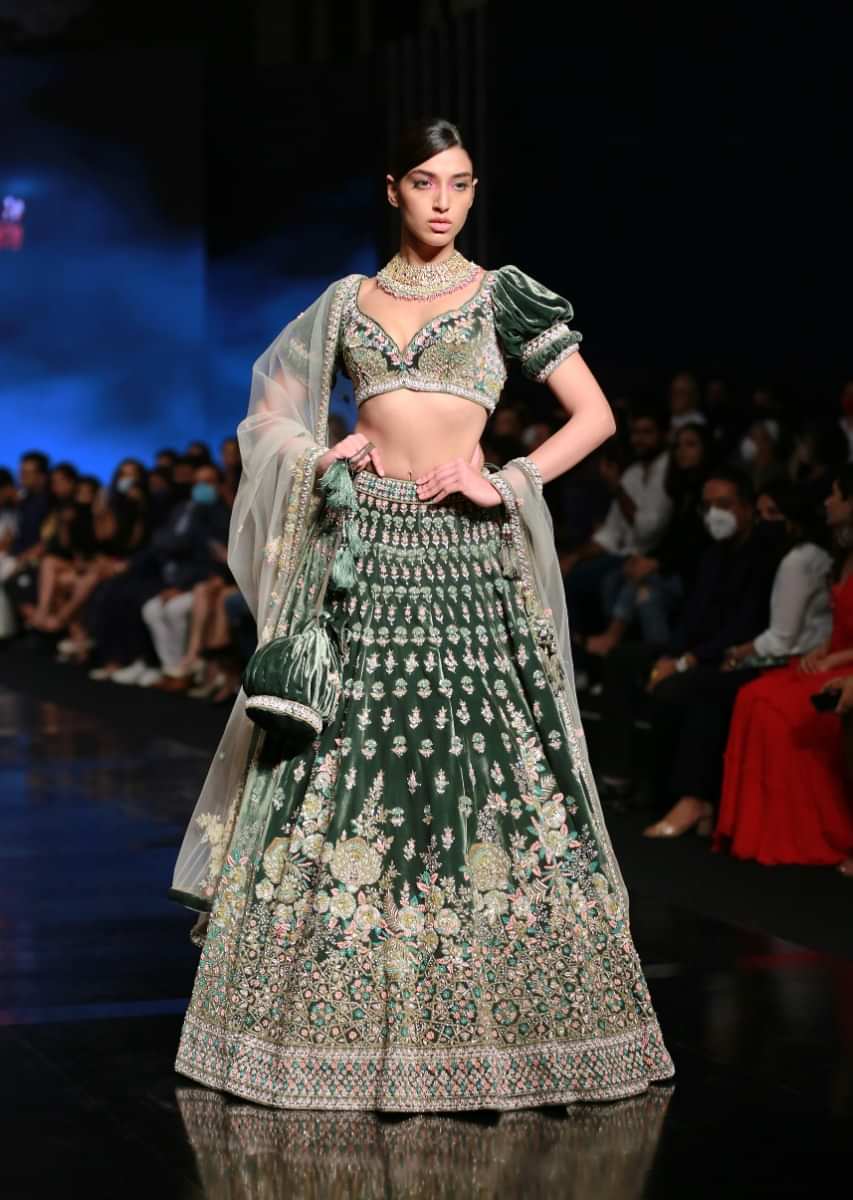 Palace Green Lehenga Choli In Velvet With Short Puff Sleeves And Multi Colored Hand Embroidery In Floral And Geometric Motifs 