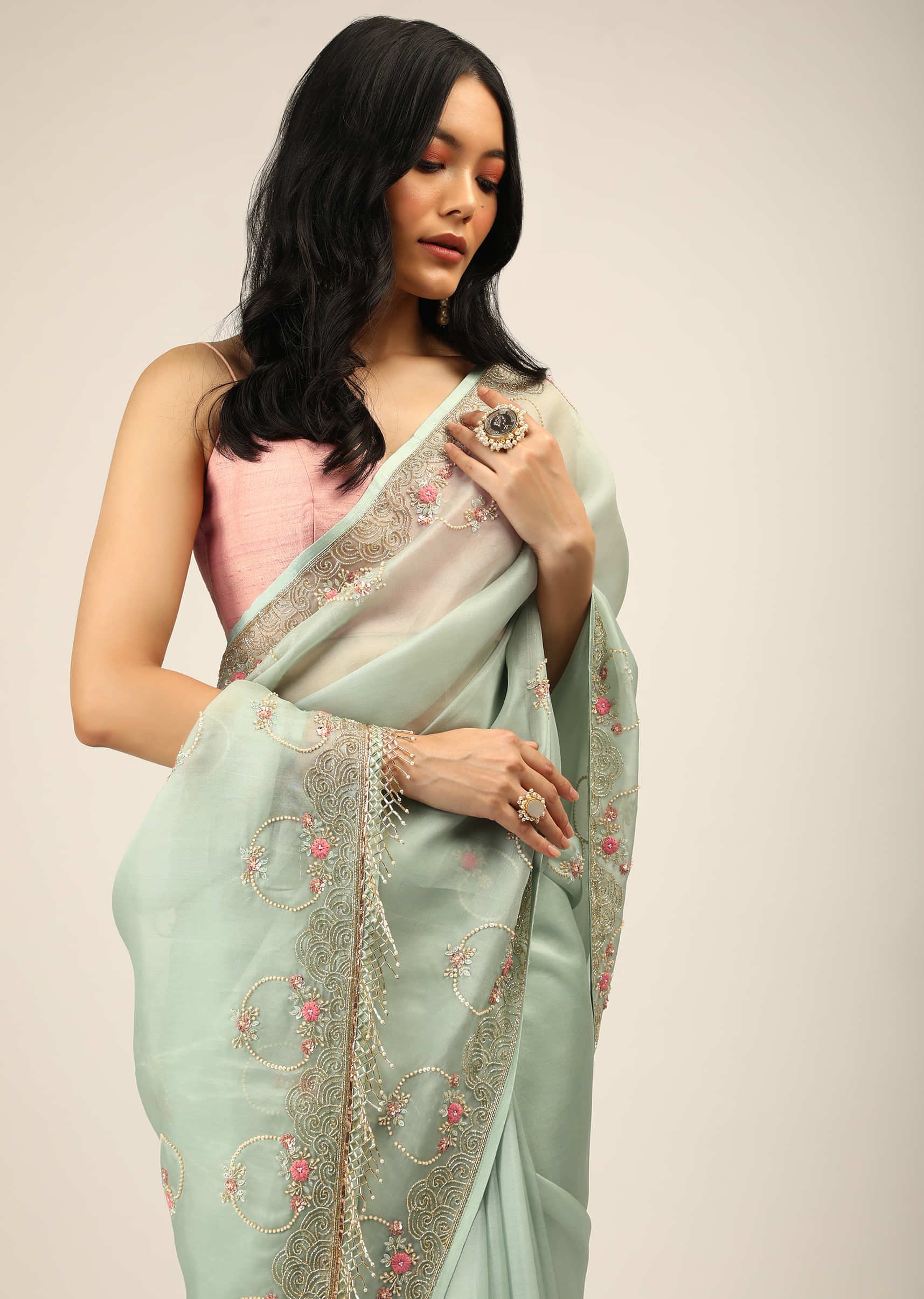 Pale Mint Saree In Organza With Multi Colored Resham And Cut Dana Embroidered Filigree And Floral Motifs On The Border And Buttis  