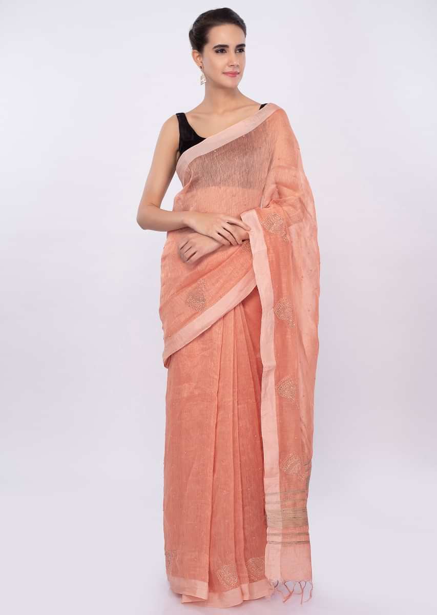 Pale orange linen saree with self moti embroidery and butti only on Kalki