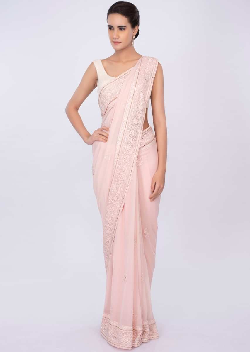 Pale pink georgette saree with self floral embroidery and butti only on kalki