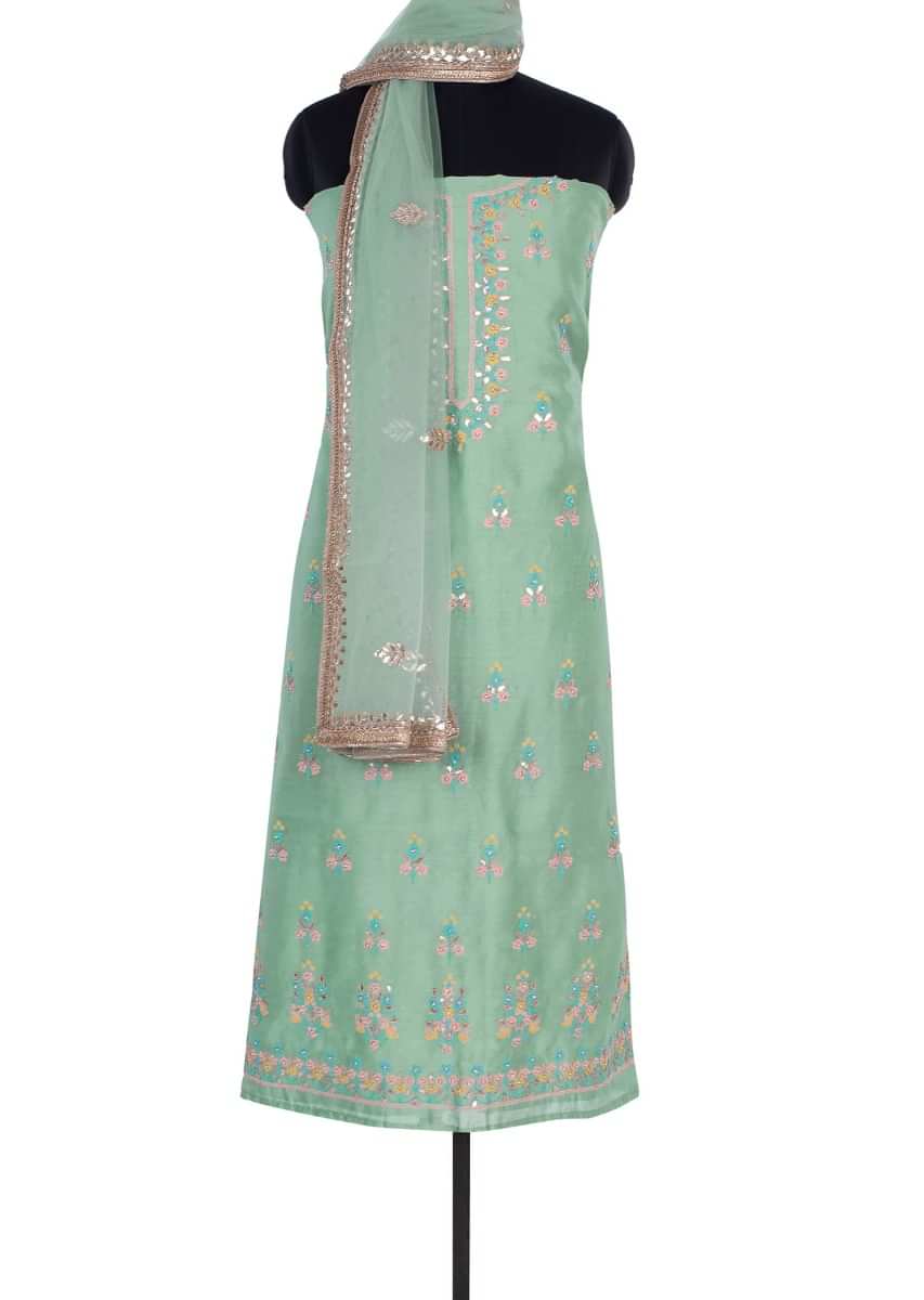 Paris green cotton unstitch suit with embroidery and butti only on Kalki
