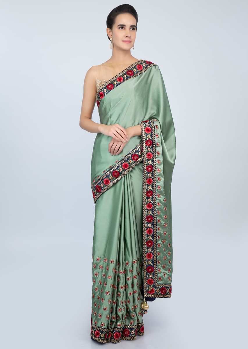 Paris green satin saree in multi color floral resham embroidery only on kalki