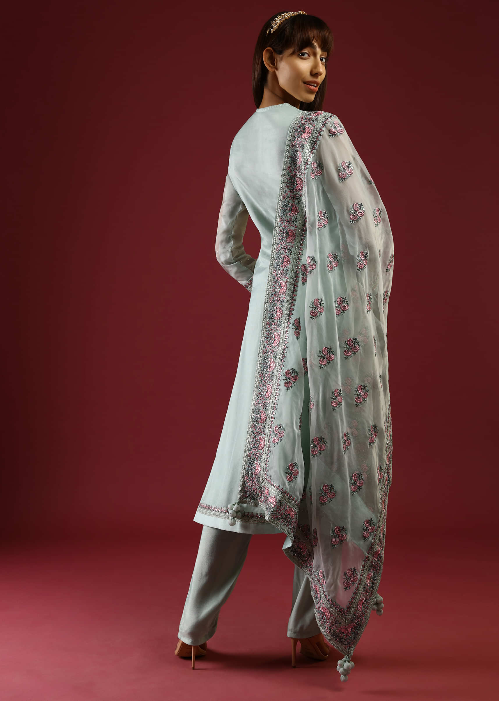 Pastel Green Straight Cut Suit With Multi Colored Thread Embroidered Floral Motifs On The Border And Buttis On The Organza Dupatta  