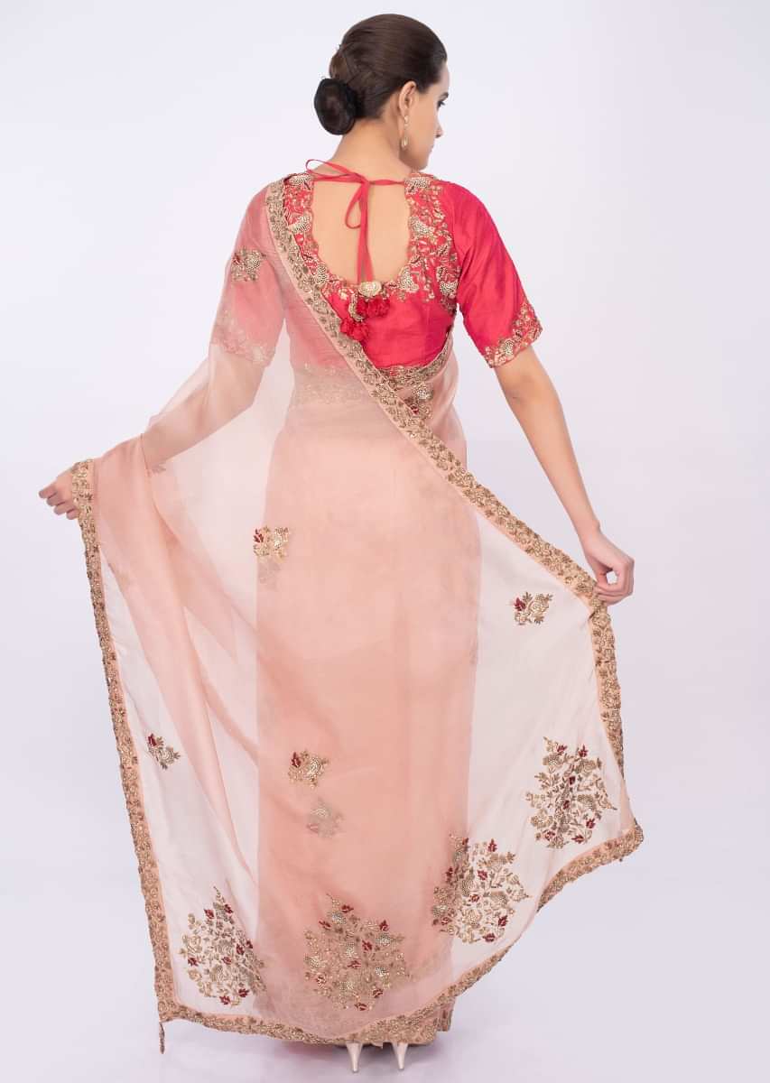 Pastel peach organza saree with coral pink raw silk blouse only on kalki