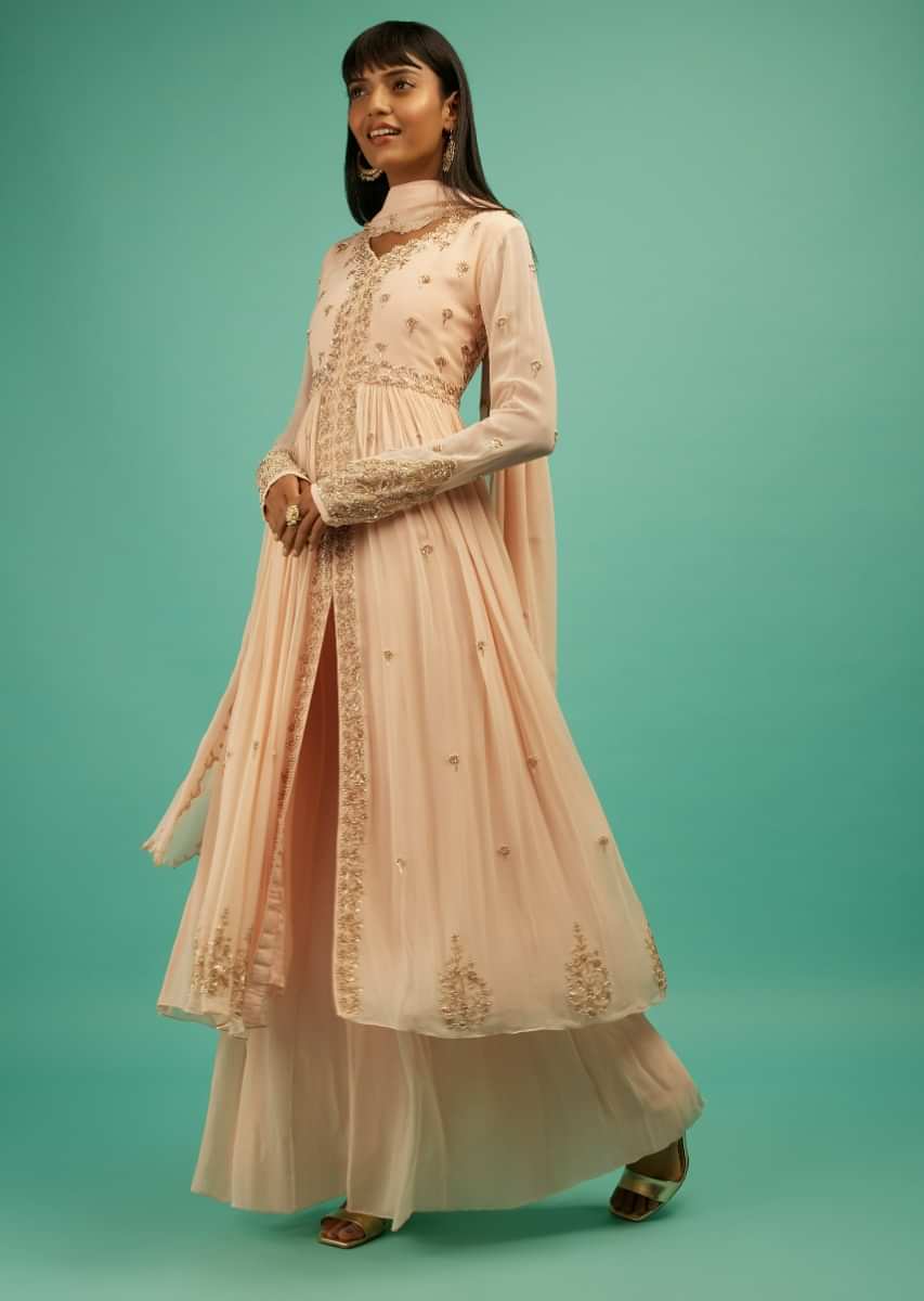 Pastel Peach Palazzo Suit In Georgette With Front Slit Kurti Featuring Cut Dana And Moti Buttis  