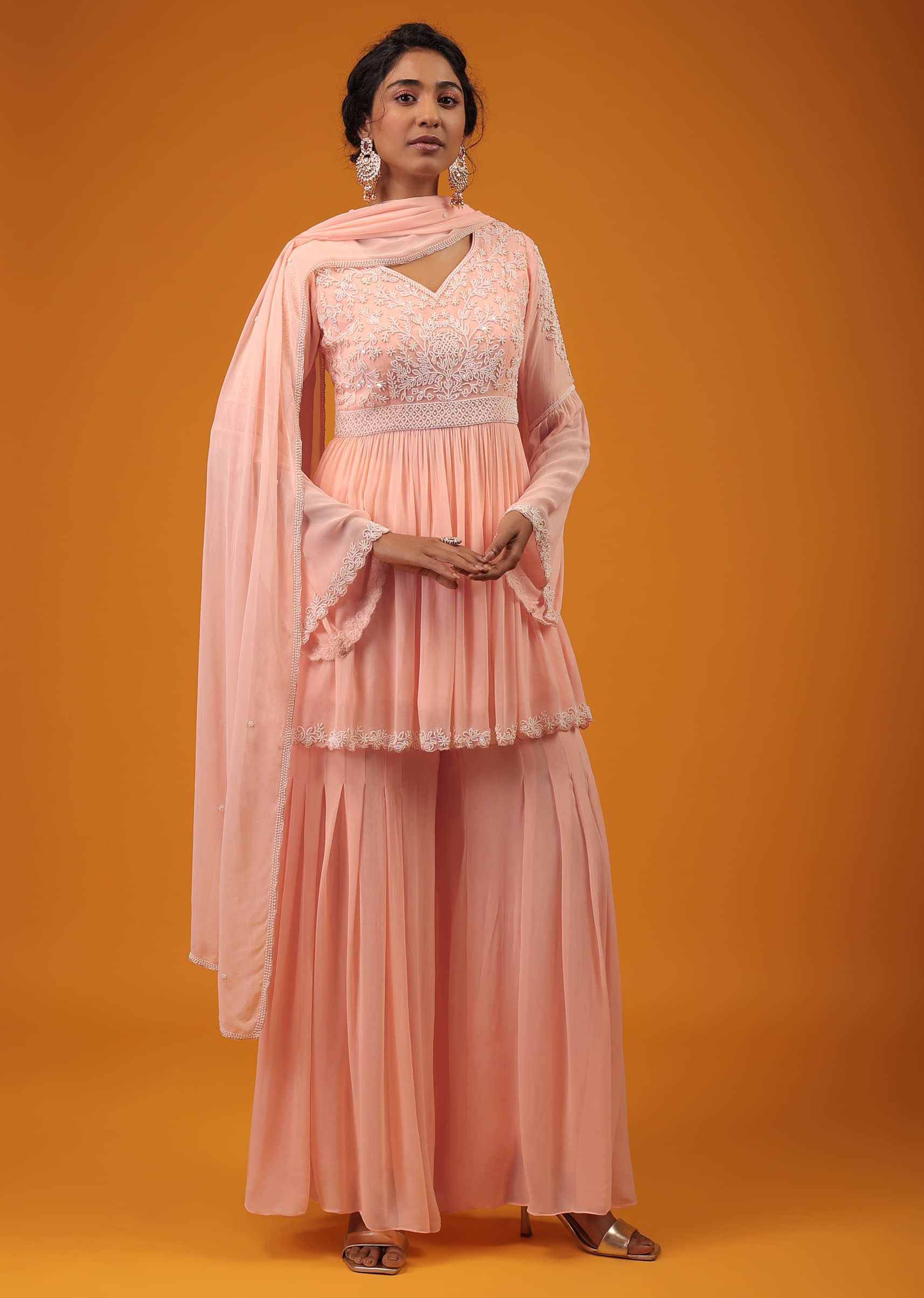 Pastel Pink Peplum Palazzo Suit In Georgette With Intricate Moti Work And Bell Sleeves