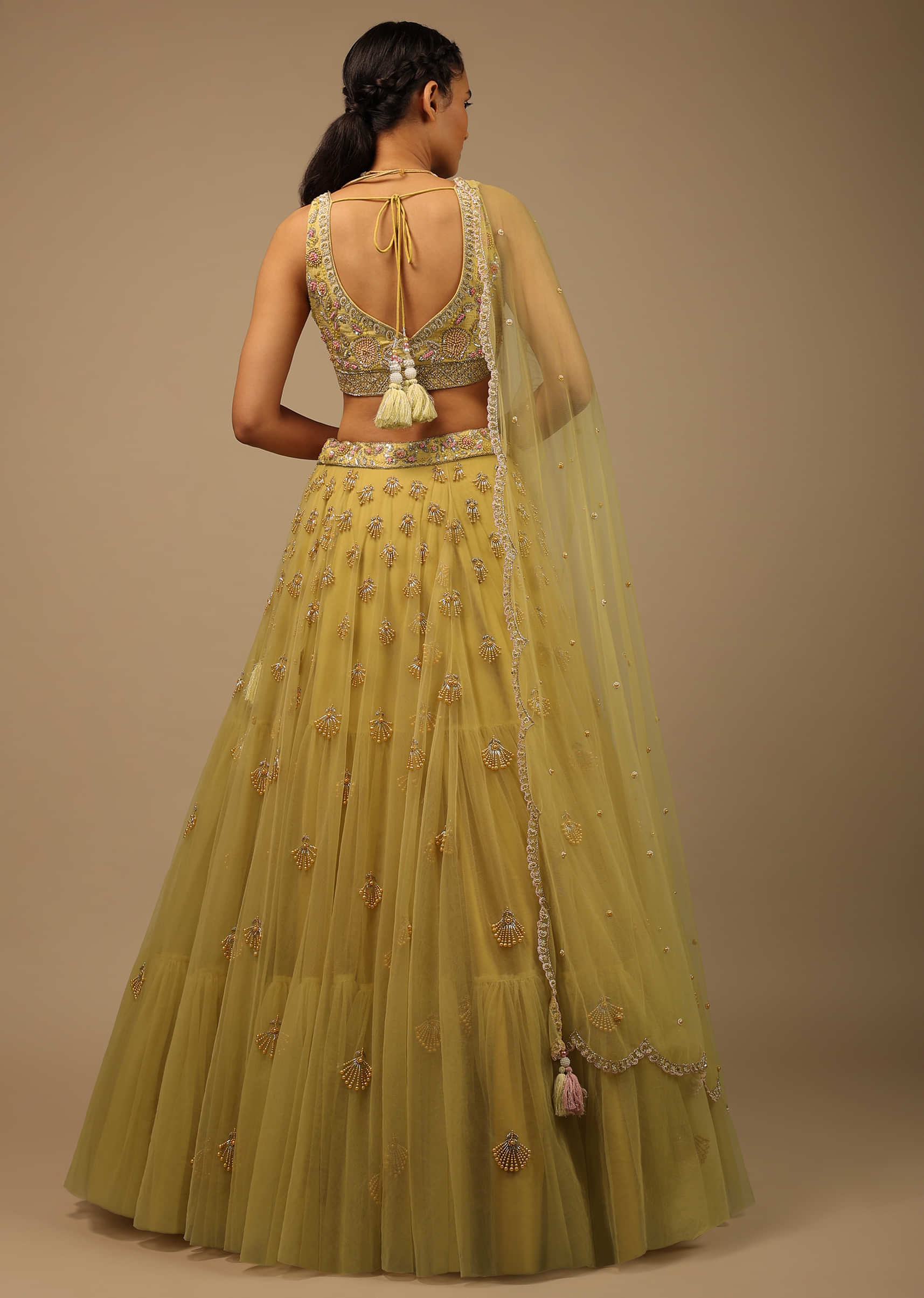 Pastel Yellow Lehenga Choli In Net With Multi Colored Beads And Sequins Embroidered Floral Motifs