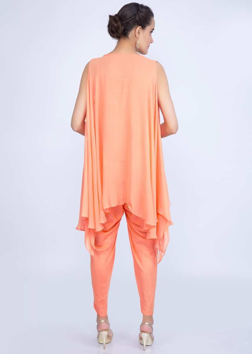 Peach assymetric cut dana embroidered top with matching santoon dhoti  pant only on kalki