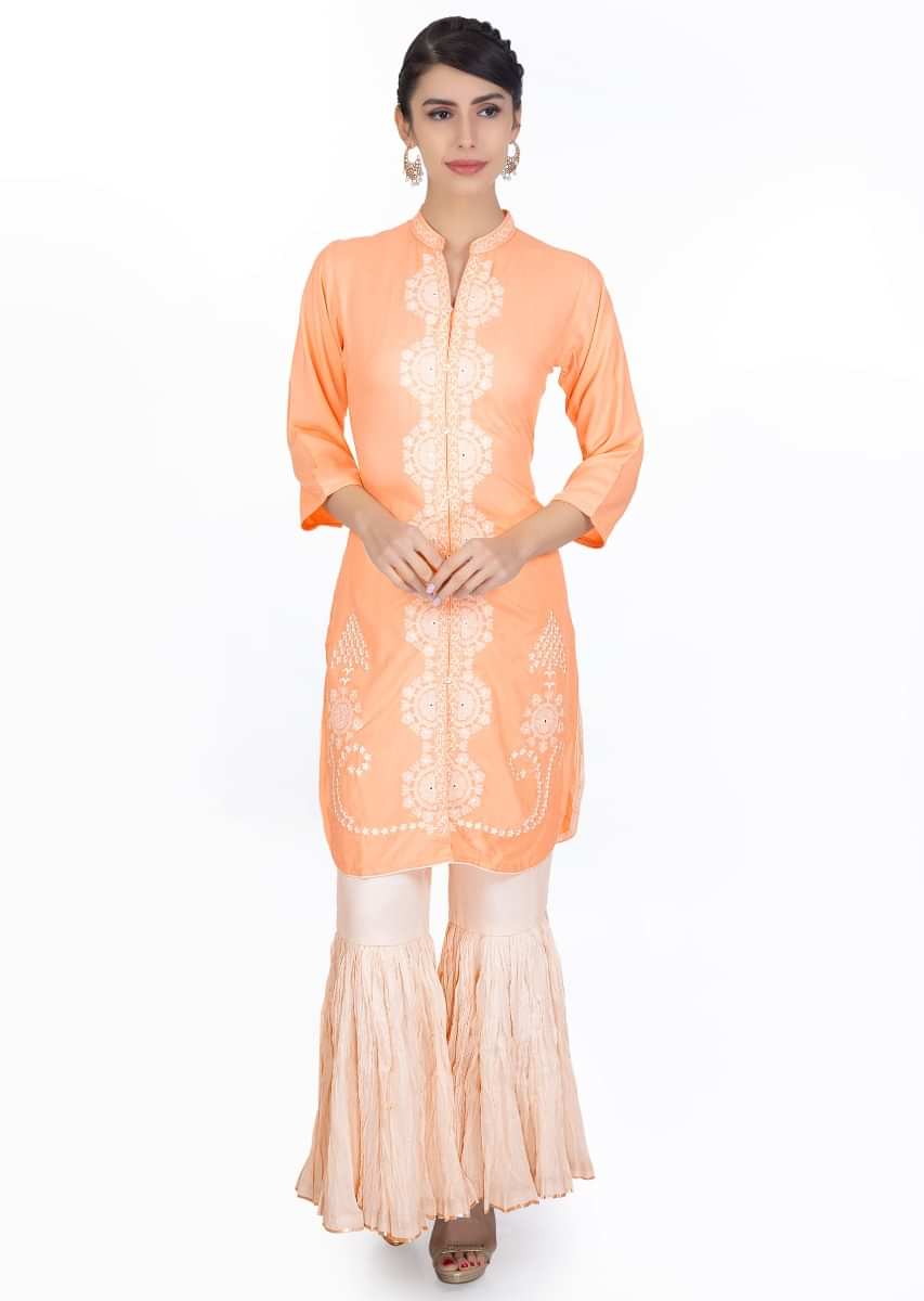 Peach cotton and resham embroidered suit paired with a off white sharara 