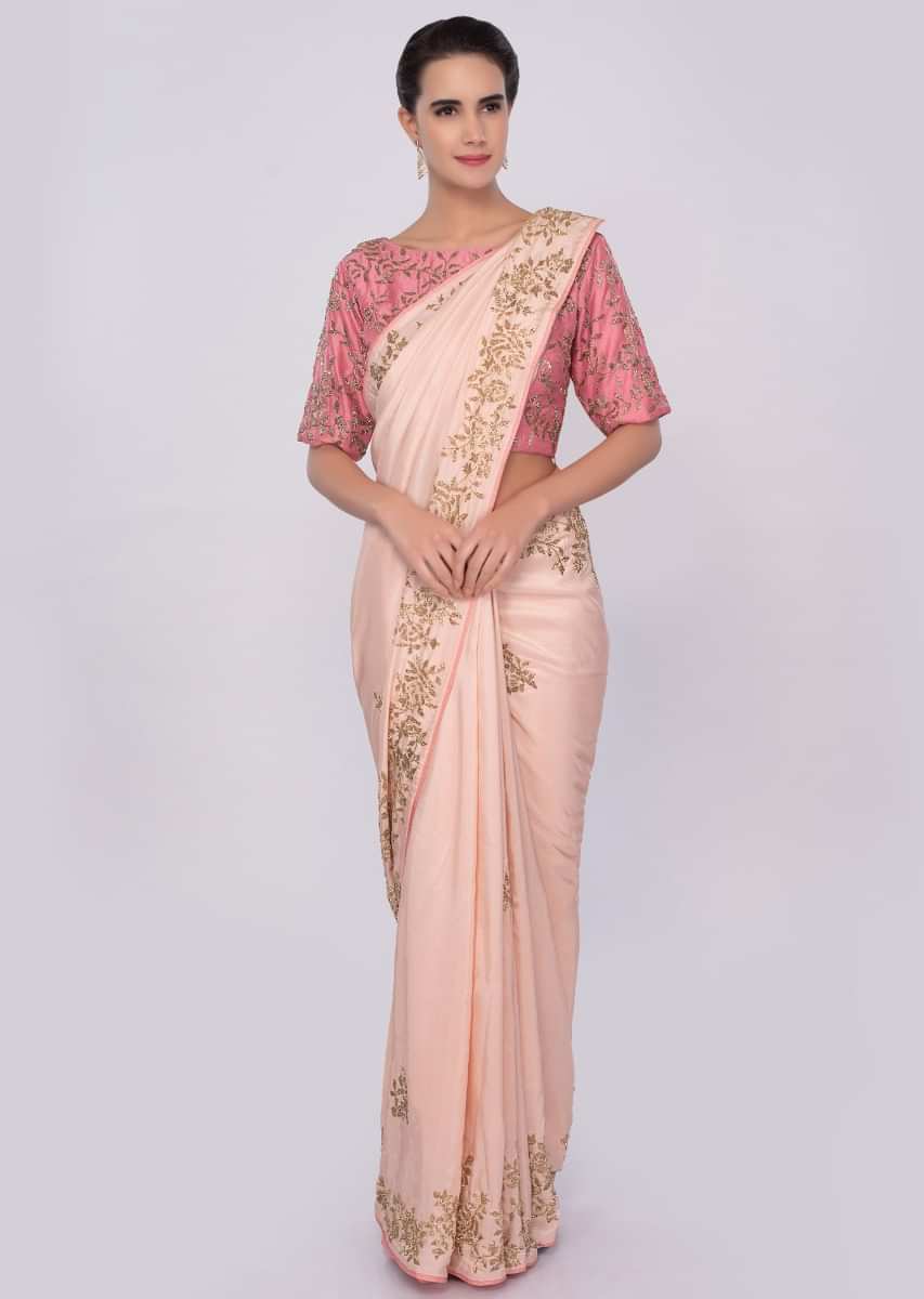 Peach cut dana embroidered saree with contrasting punch pink blouse