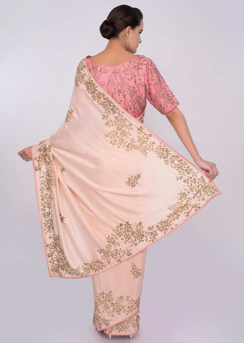 Peach cut dana embroidered saree with contrasting punch pink blouse