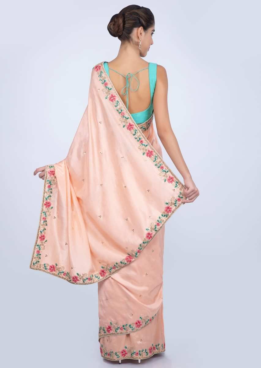 Peach dupion silk saree with embroidered butti and border only on kalki