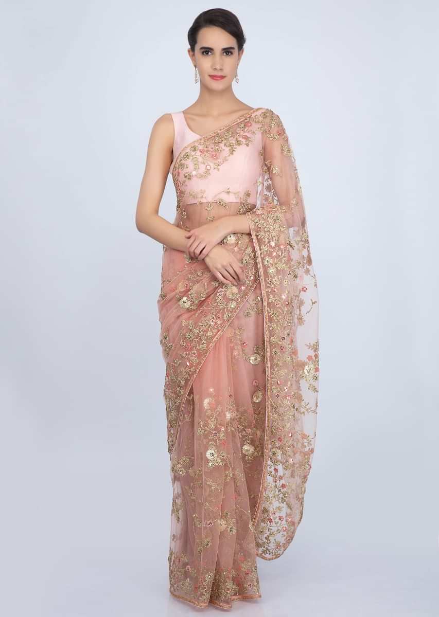 Peach embroidered net saree with cord and thread jaal work only on Kalki