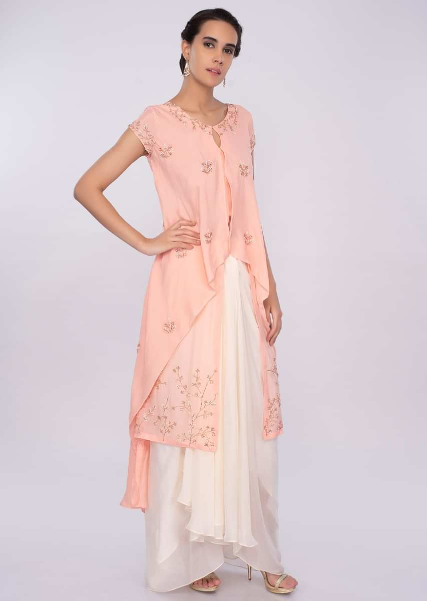 Peach Top With Fancy Layers And Off White Skirt In Pleats Online - Kalki Fashion