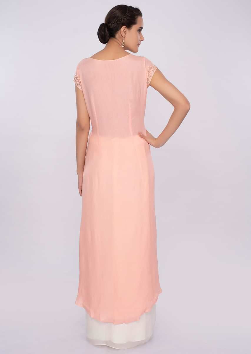 Peach Top With Fancy Layers And Off White Skirt In Pleats Online - Kalki Fashion